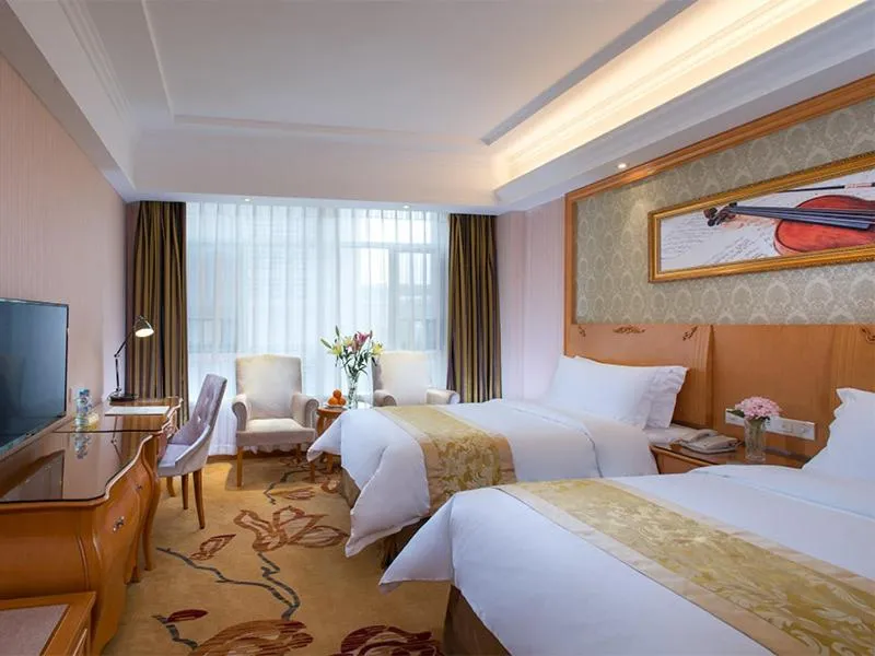 Bed in Vienna Hotel Guangdong Heyuan Lianping