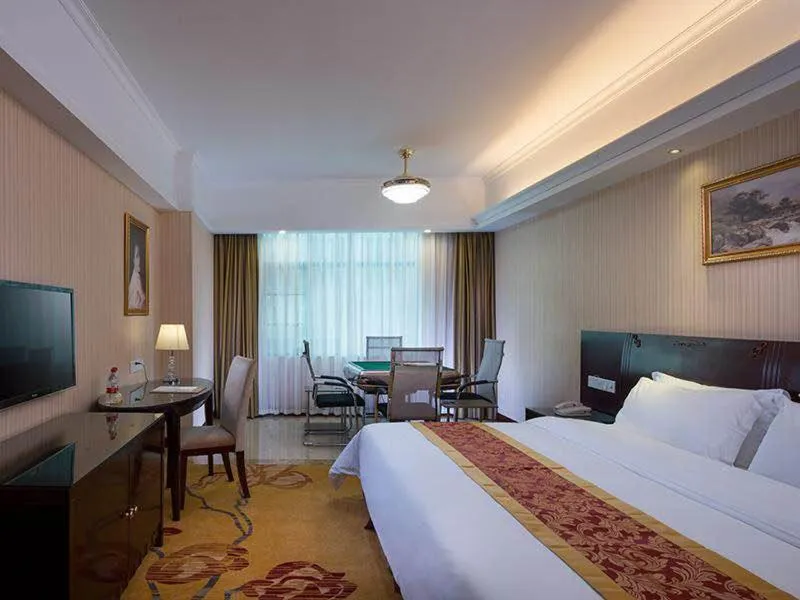 Bed in Vienna Hotel Guangdong Heyuan Lianping