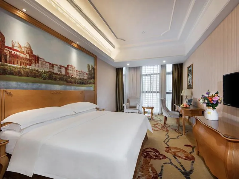 Bed in Vienna International Hotel Fuzhou Cangshan Wanda
