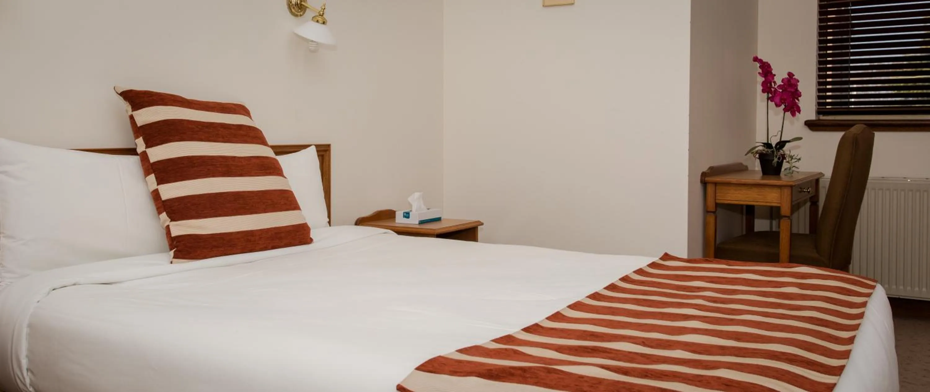 Bed in La Maison Boutique Hotel