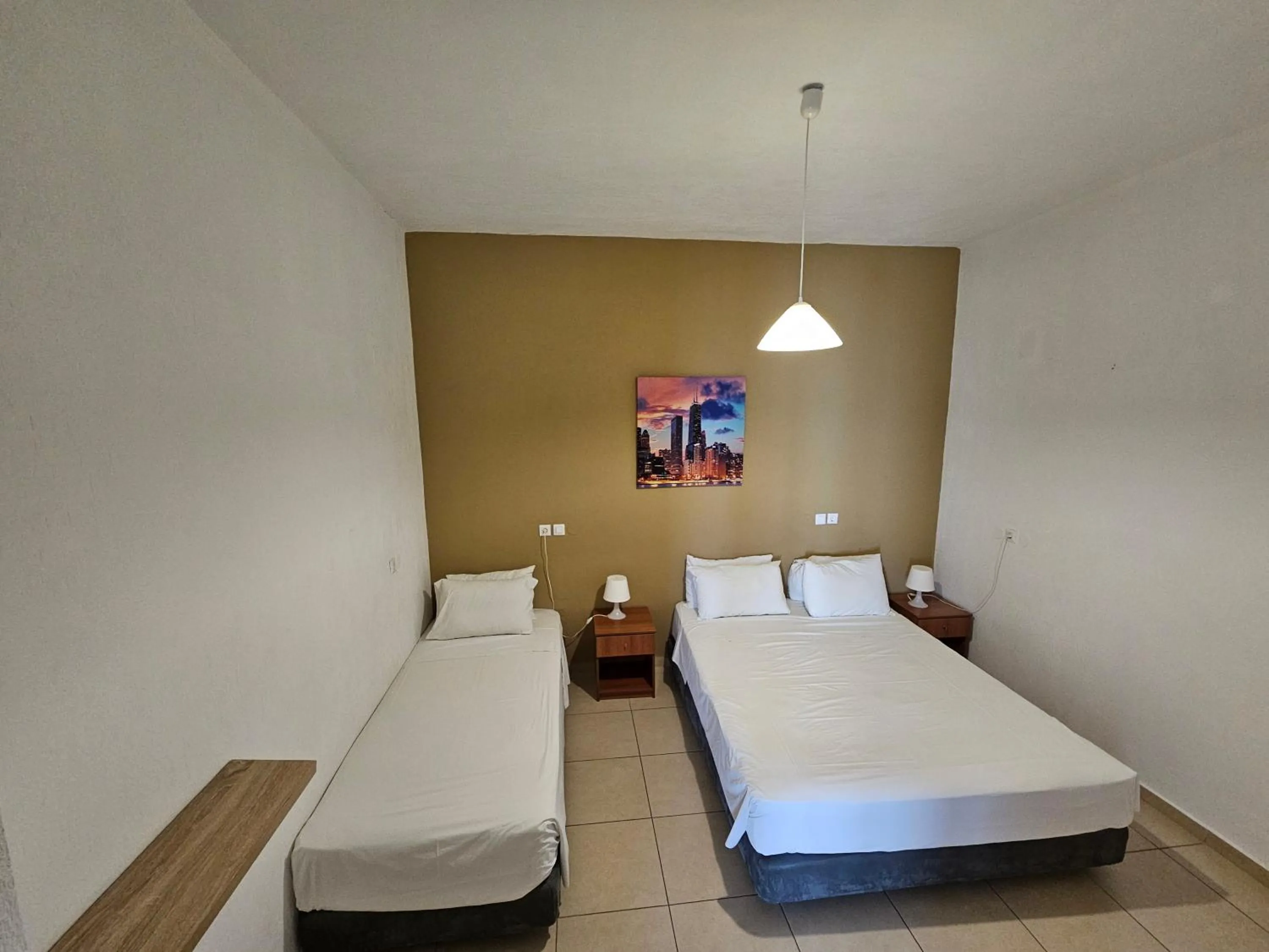 Bed in Elounda Sunrise Apartments