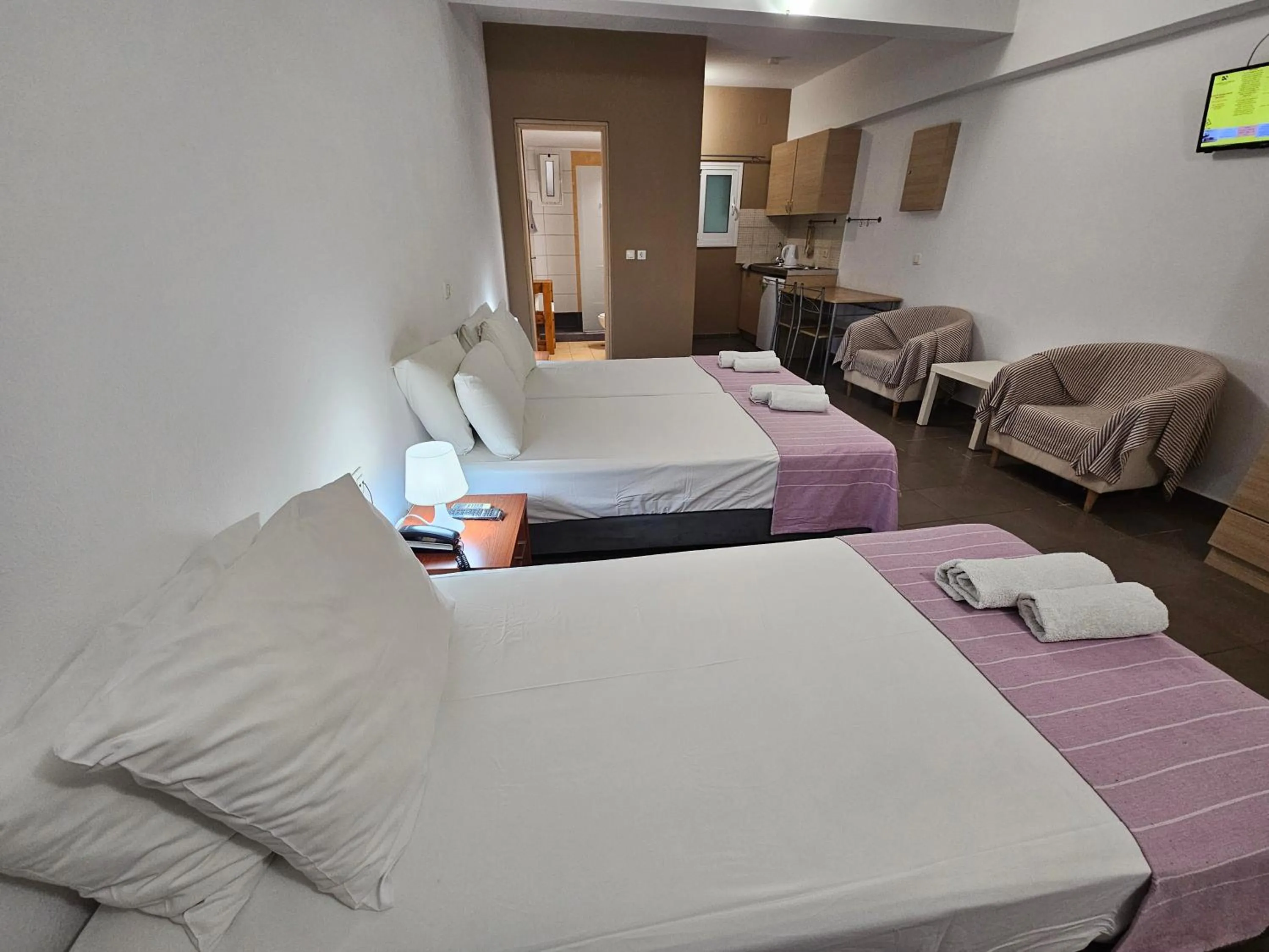 Bed in Elounda Sunrise Apartments