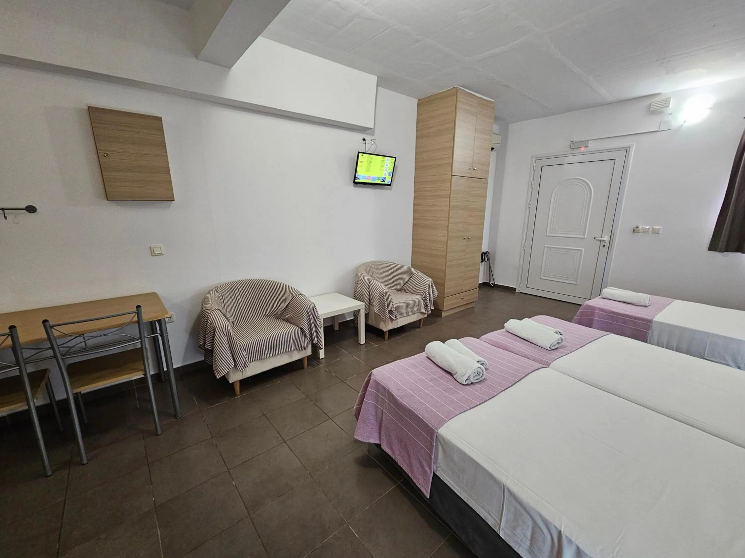 Bed in Elounda Sunrise Apartments