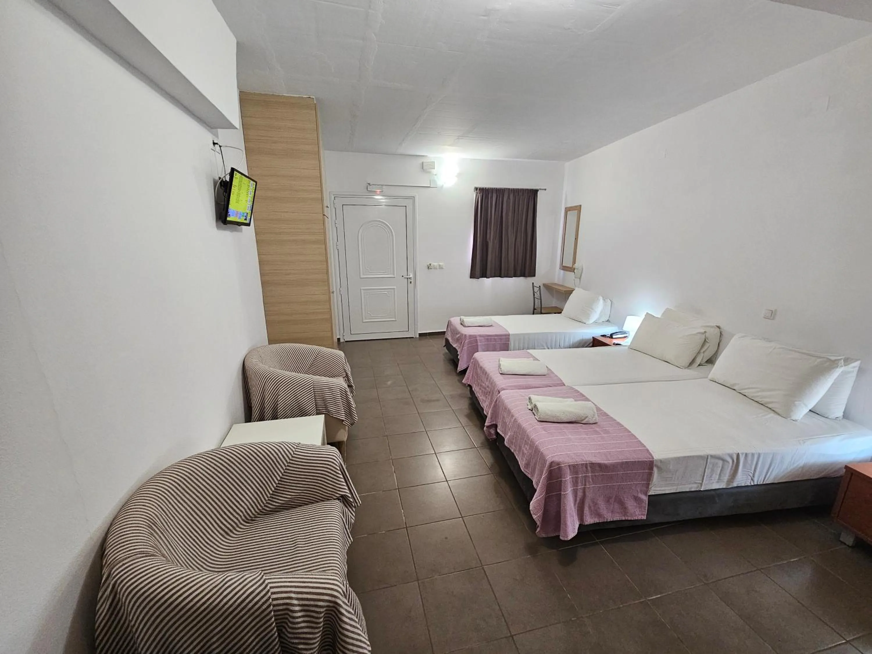 Bed in Elounda Sunrise Apartments