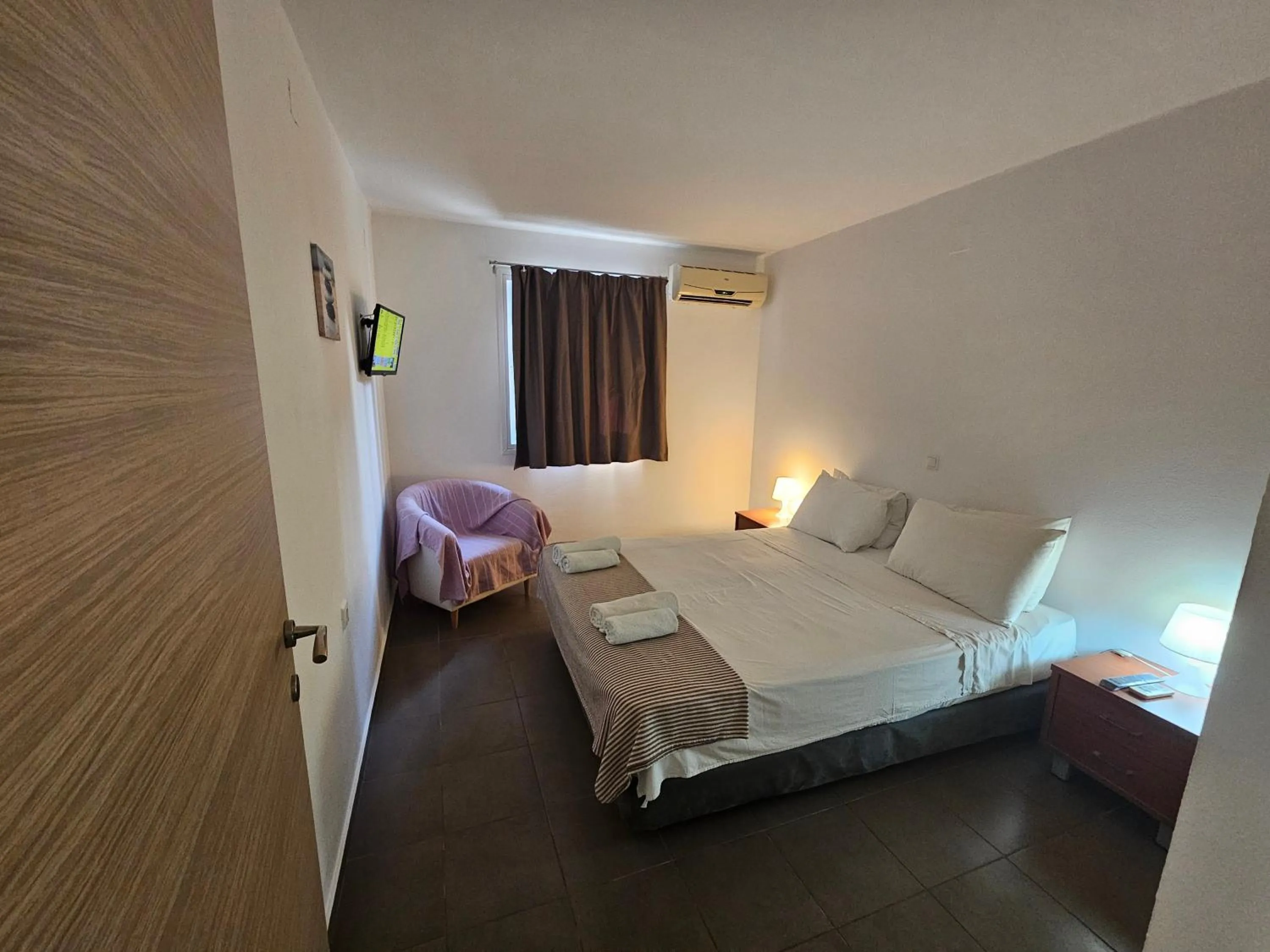 Bed in Elounda Sunrise Apartments