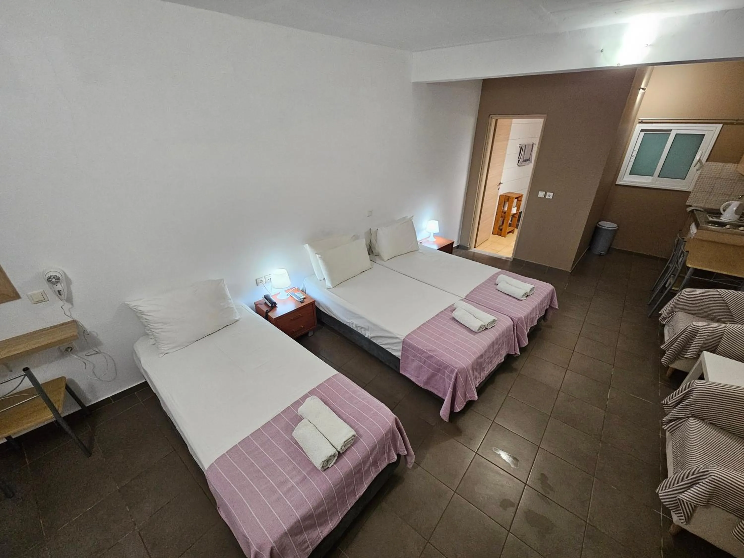 Bed in Elounda Sunrise Apartments