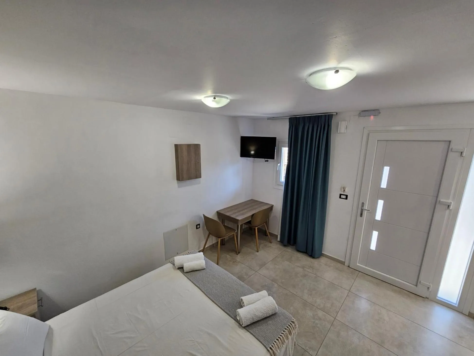 Bed in Elounda Sunrise Apartments