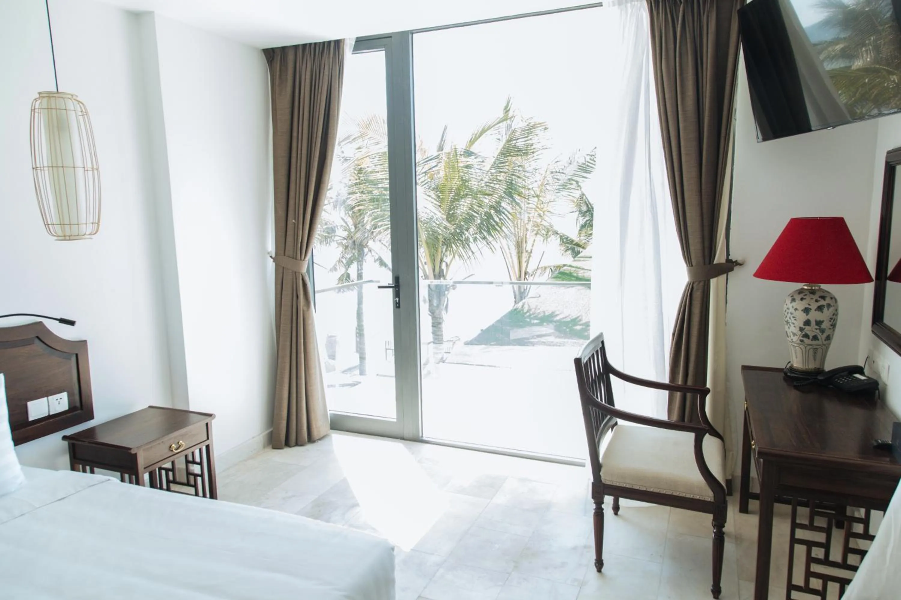 Bed in The Palmy Phu Quoc Resort & Spa