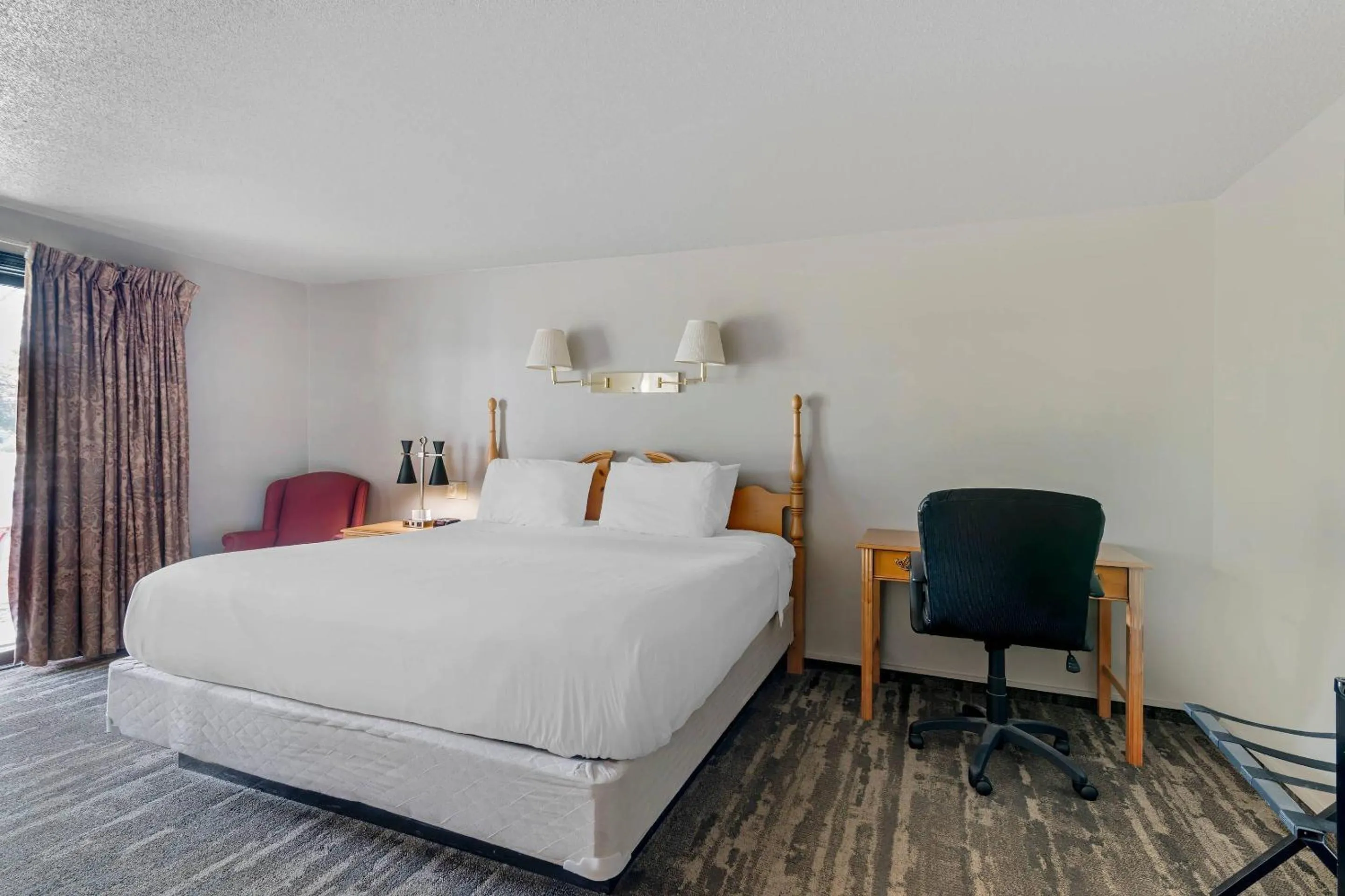 Bedroom, Bed in Green Granite Inn, an Ascend Collection Hotel
