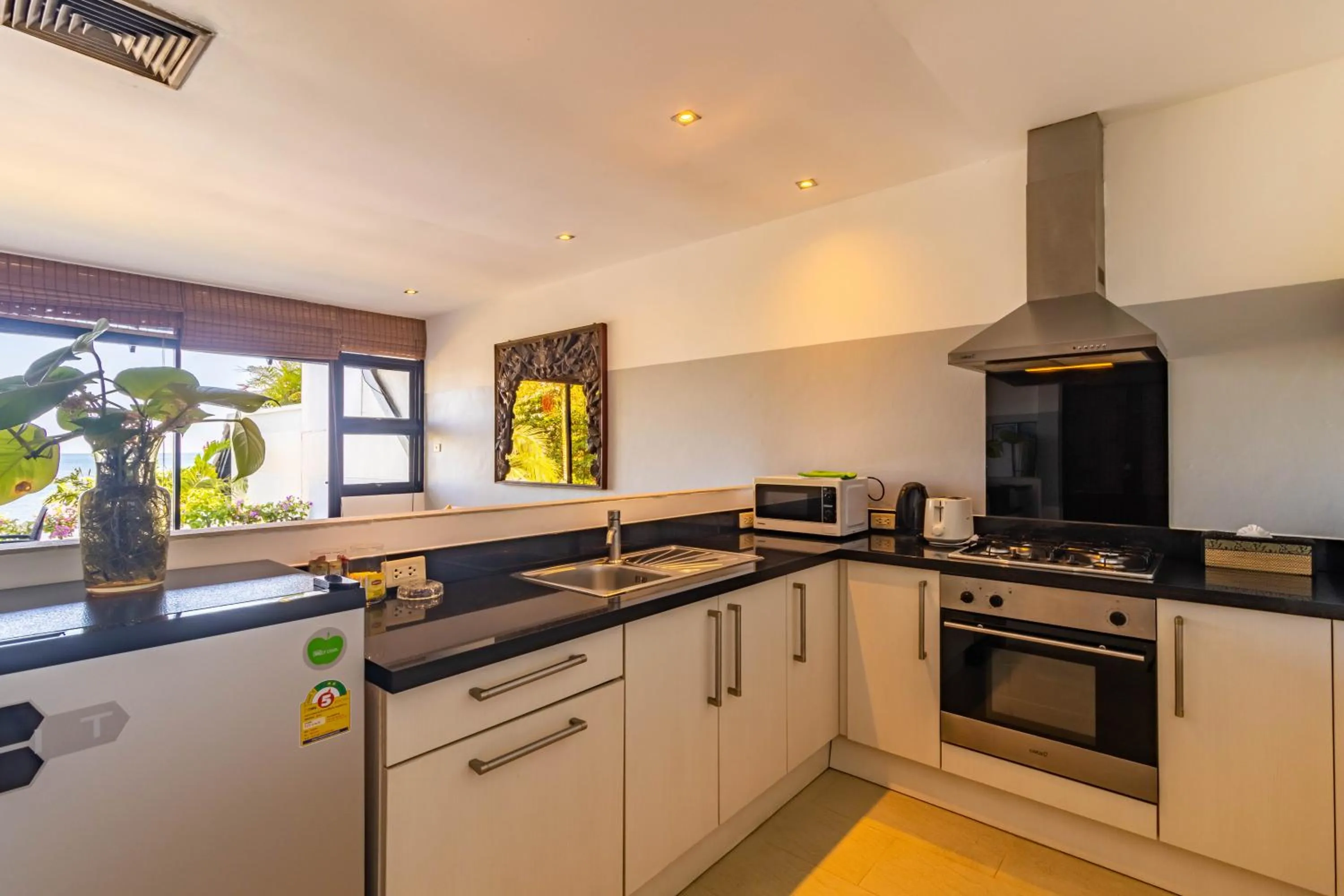 kitchen in Kamala Beach Estate Resort - SHA Extra Plus