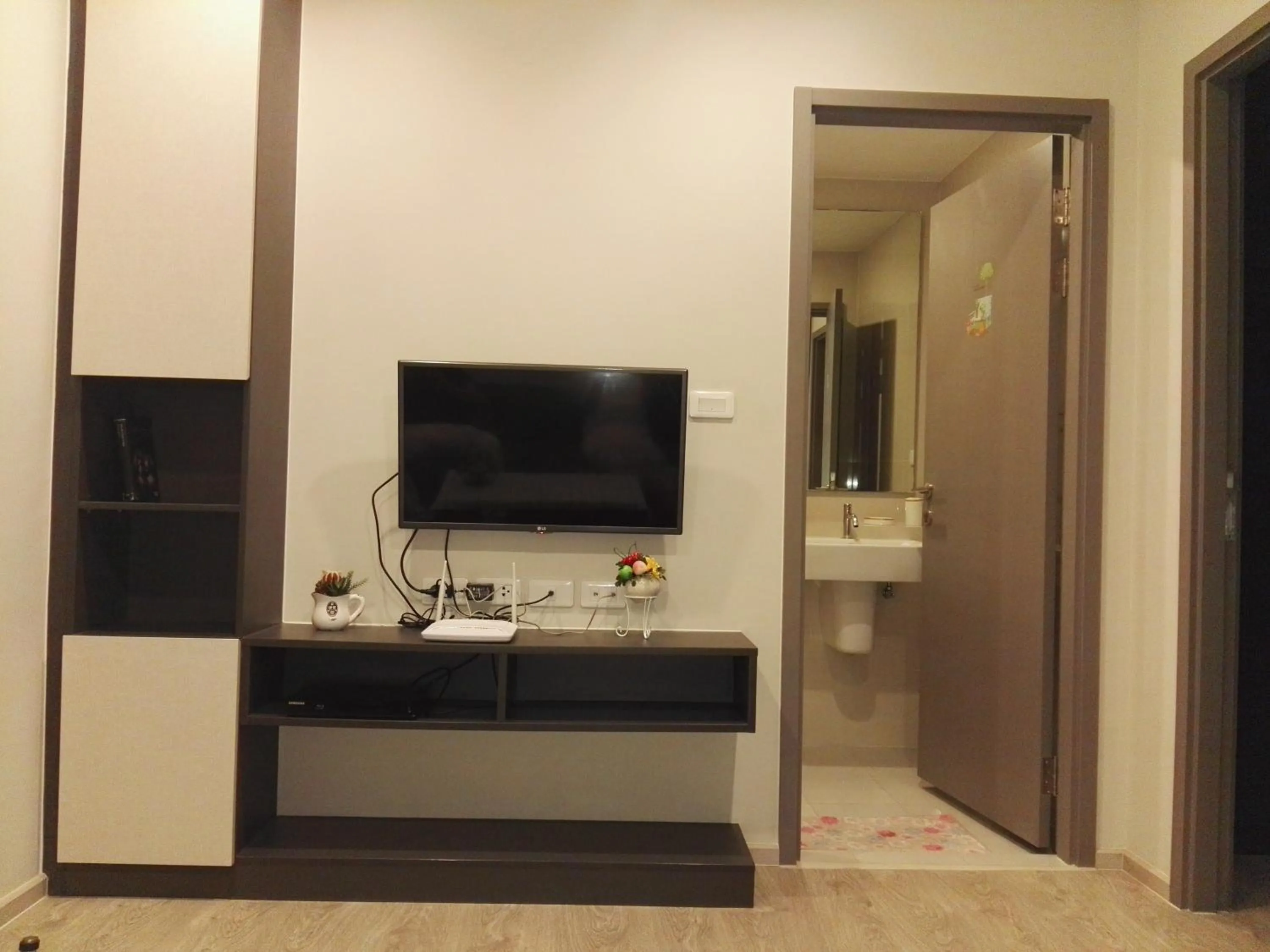 Living room in LLX Apartments at The Base condo