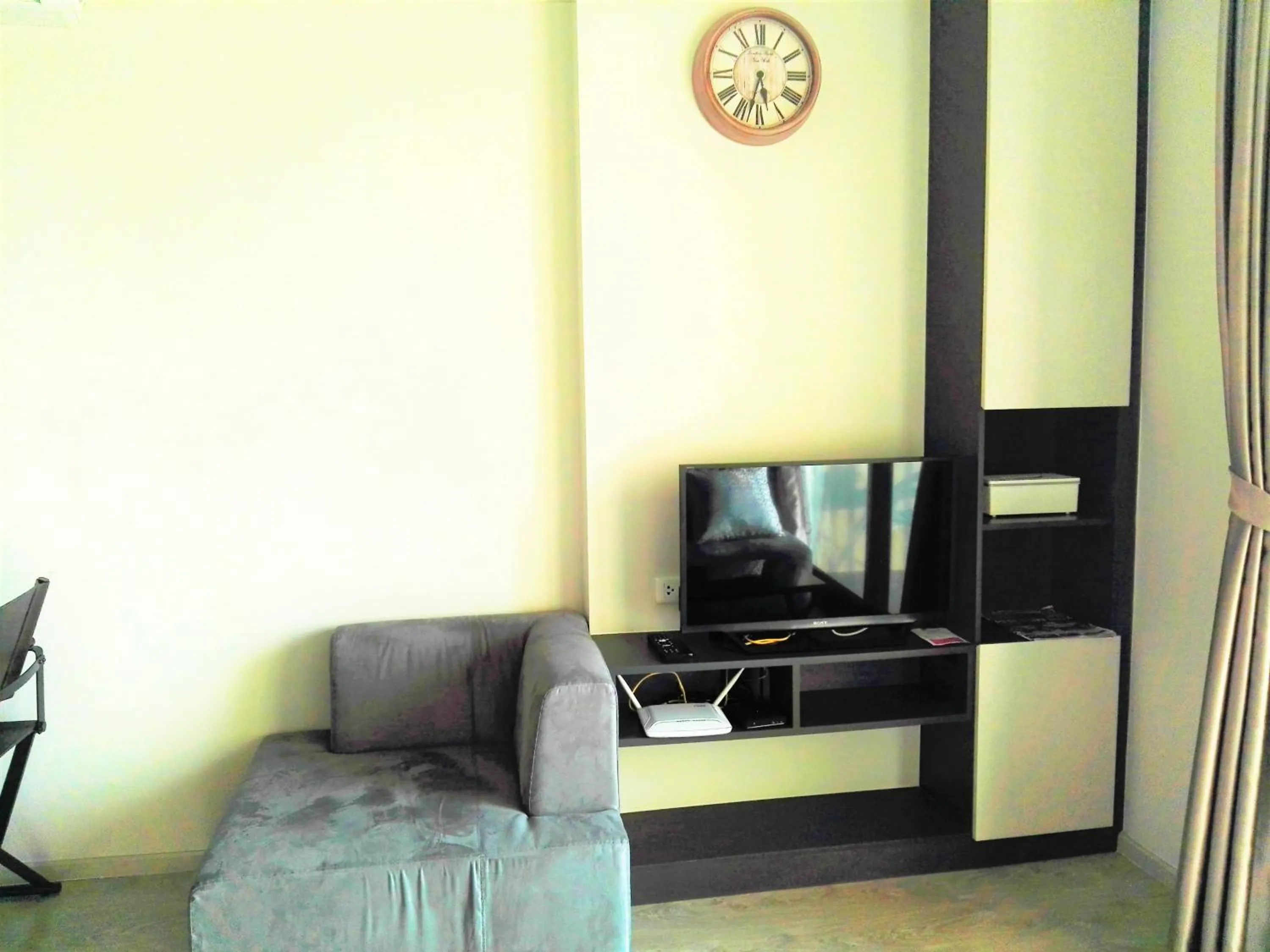 Living room in LLX Apartments at The Base condo