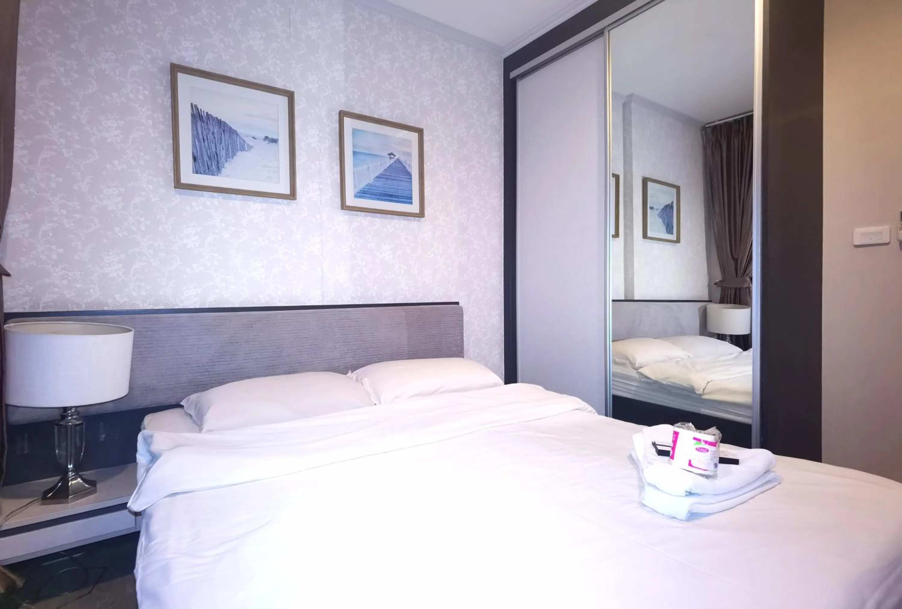 Bed in LLX Apartments at The Base condo