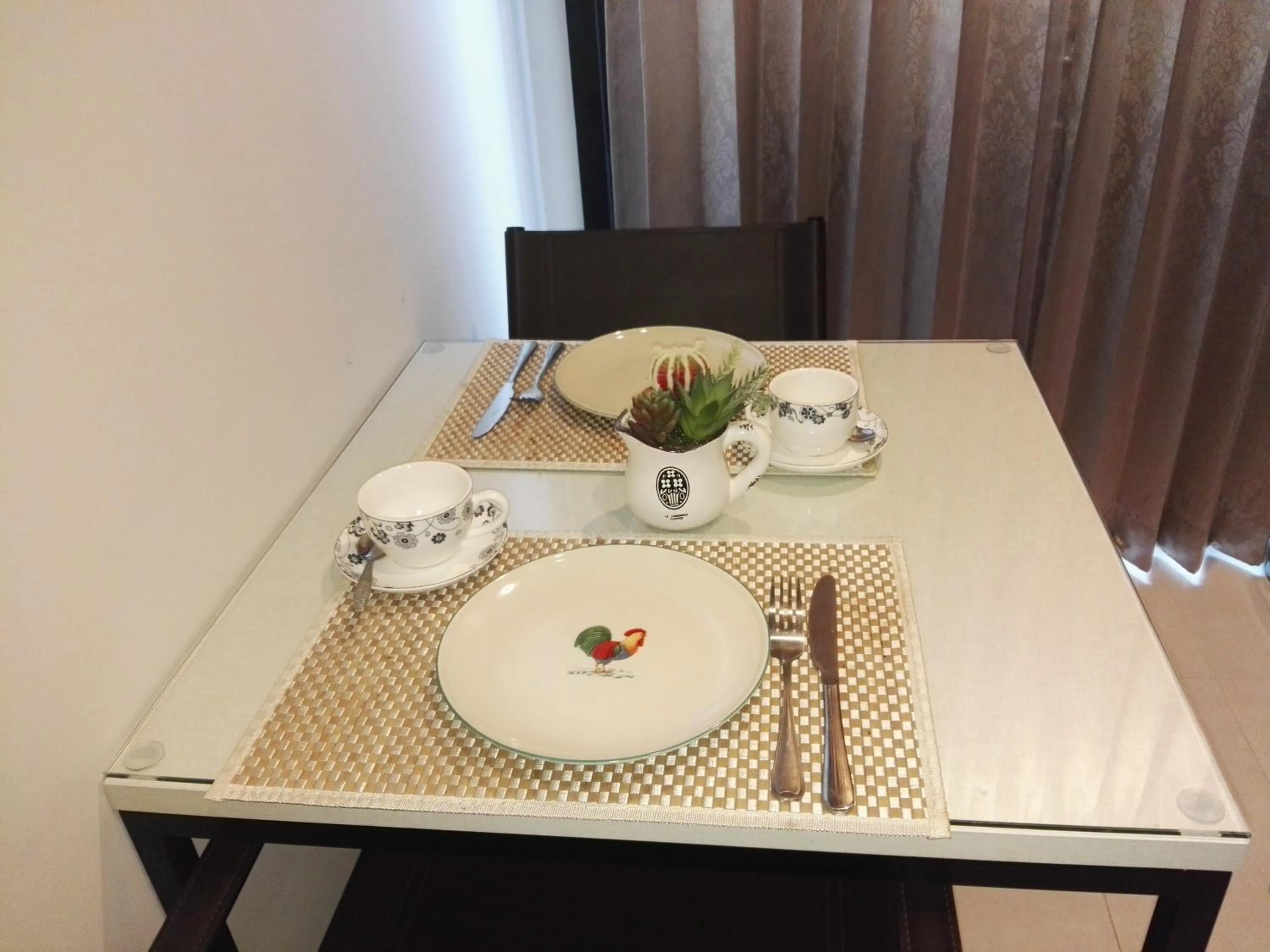 Dining area in LLX Apartments at The Base condo