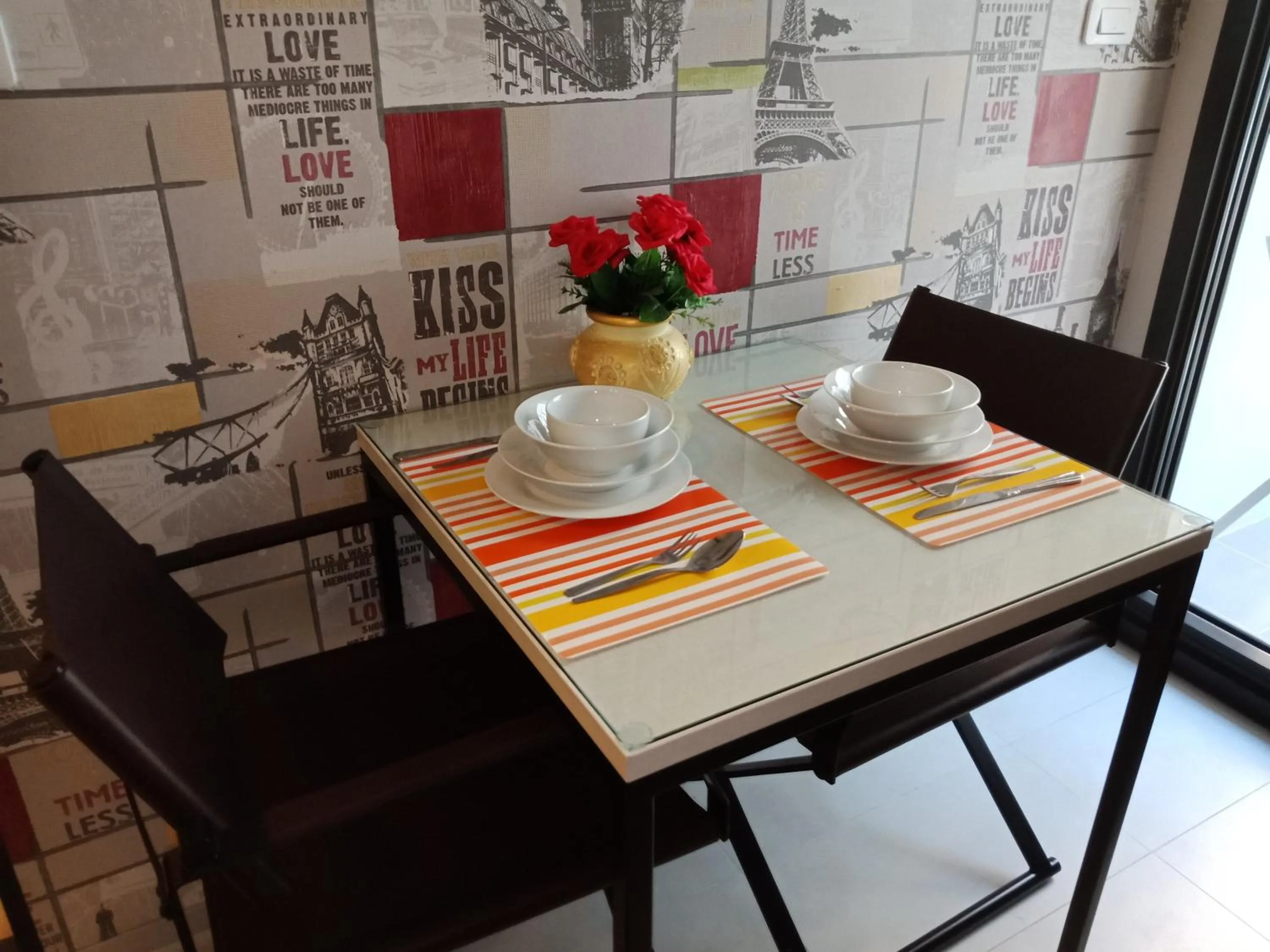 Dining area in LLX Apartments at The Base condo