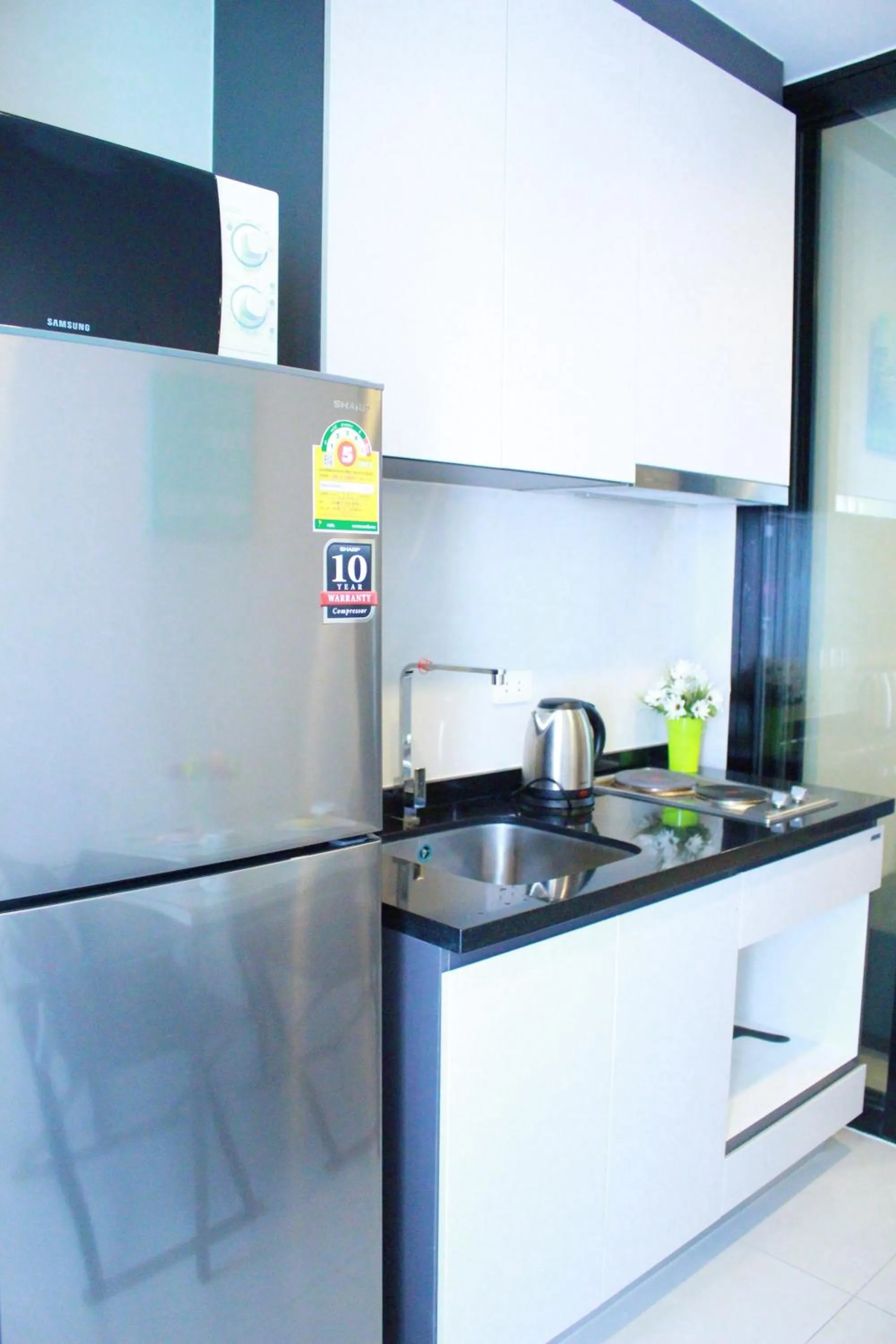 Kitchen or kitchenette in LLX Apartments at The Base condo