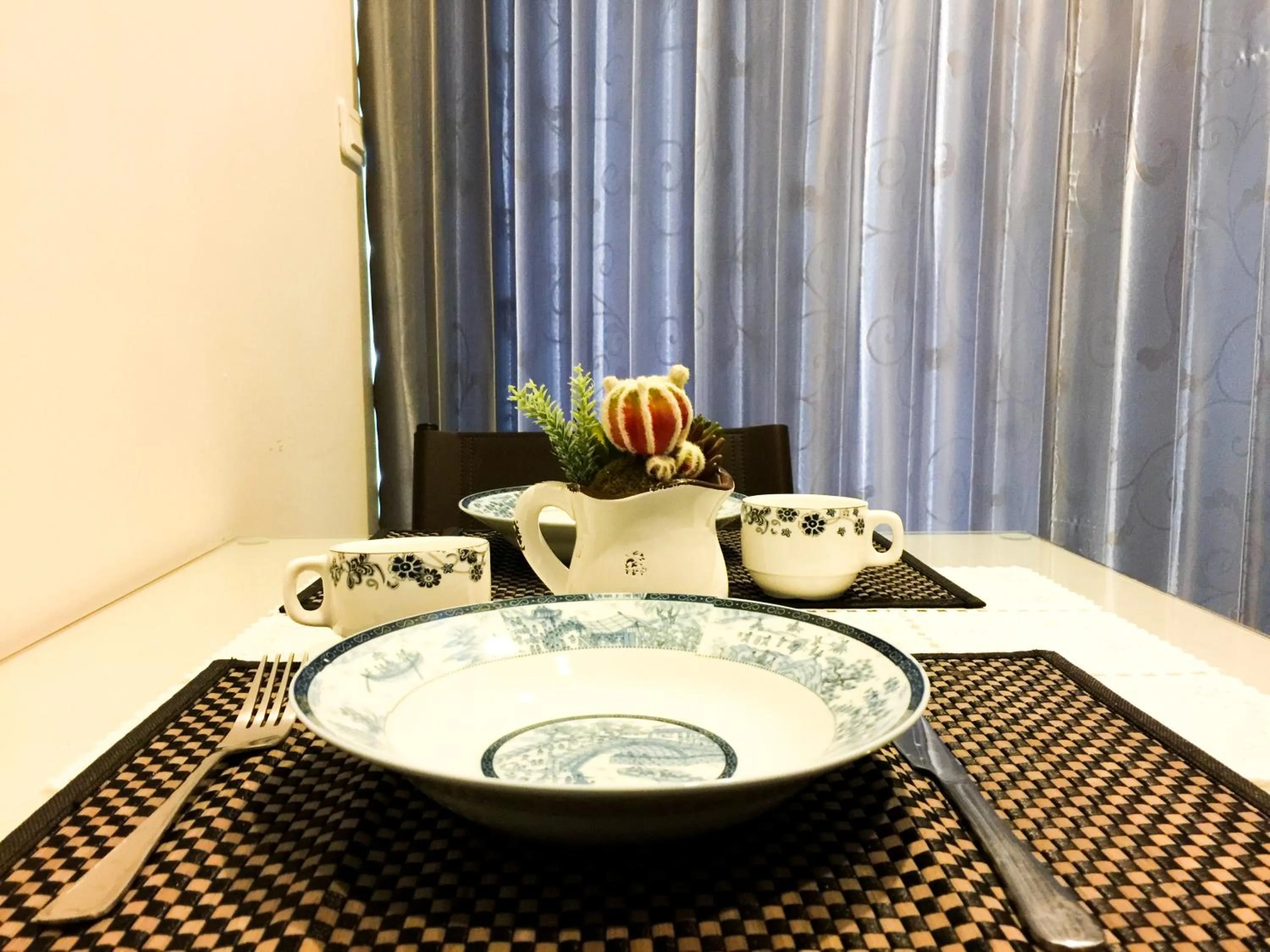 Dining area in LLX Apartments at The Base condo