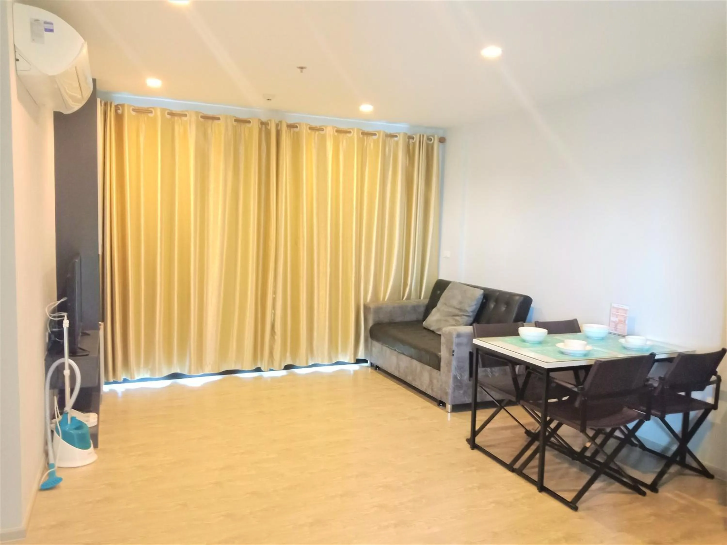 Living room in LLX Apartments at The Base condo