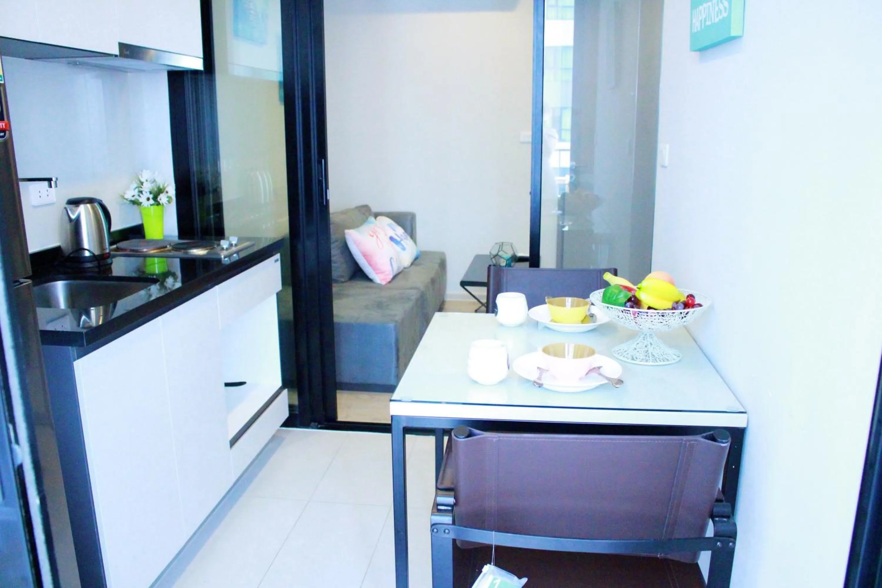 Dining area in LLX Apartments at The Base condo