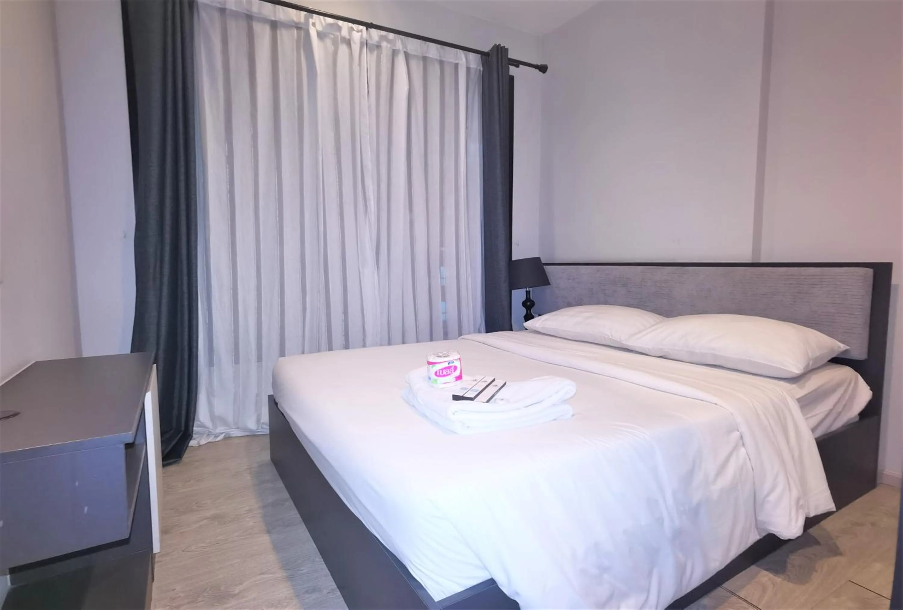 Bed in LLX Apartments at The Base condo