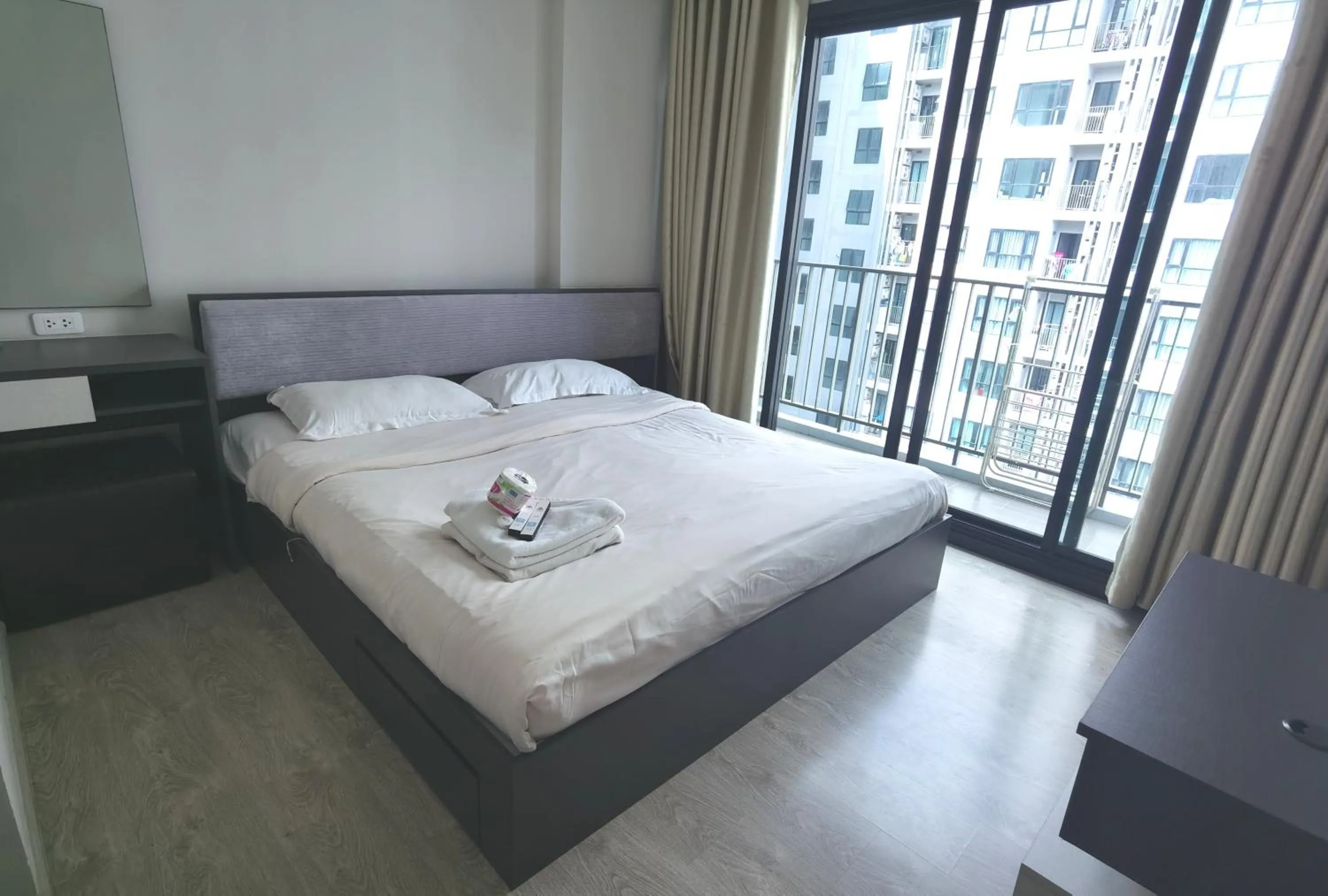 Bed in LLX Apartments at The Base condo