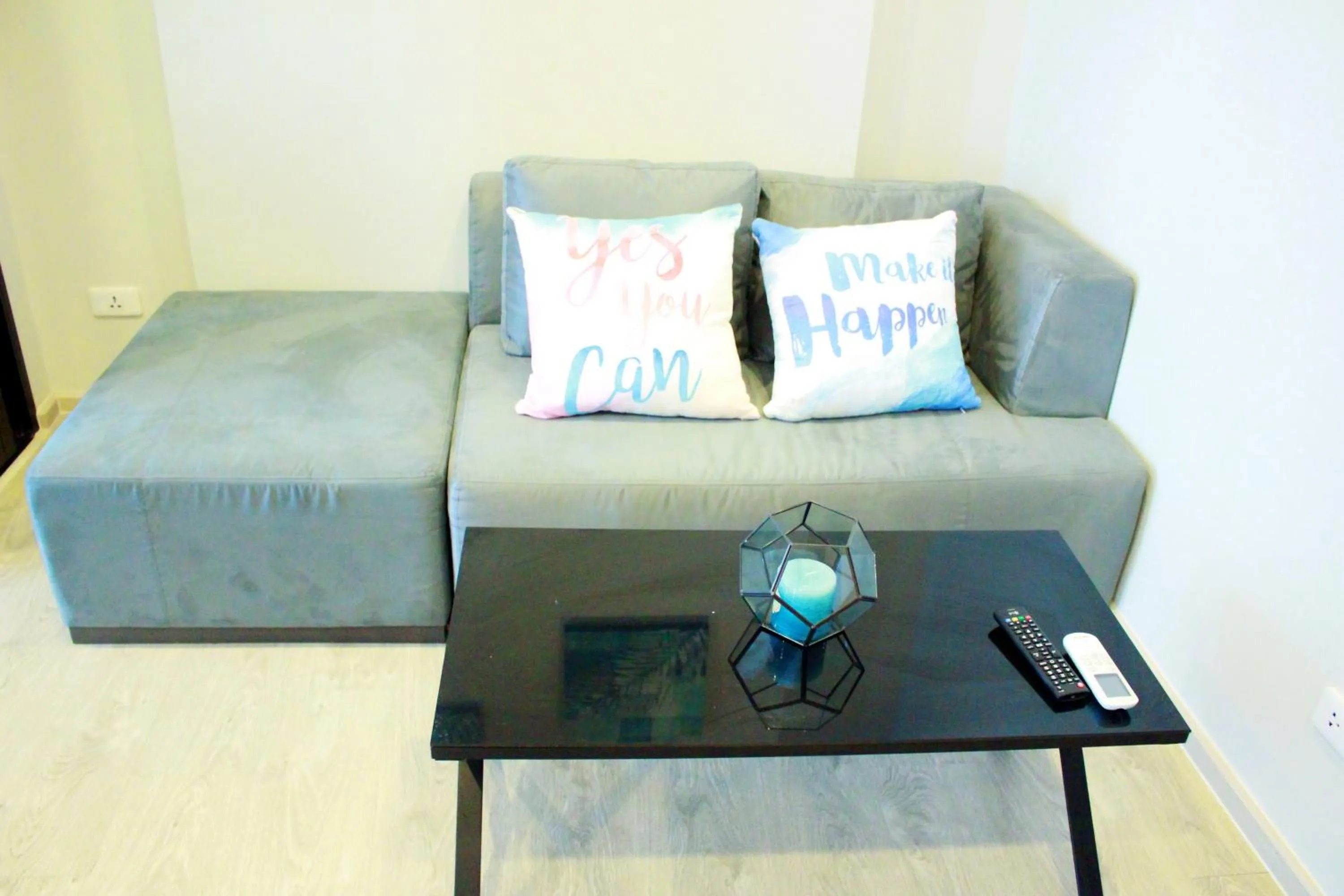 Living room in LLX Apartments at The Base condo