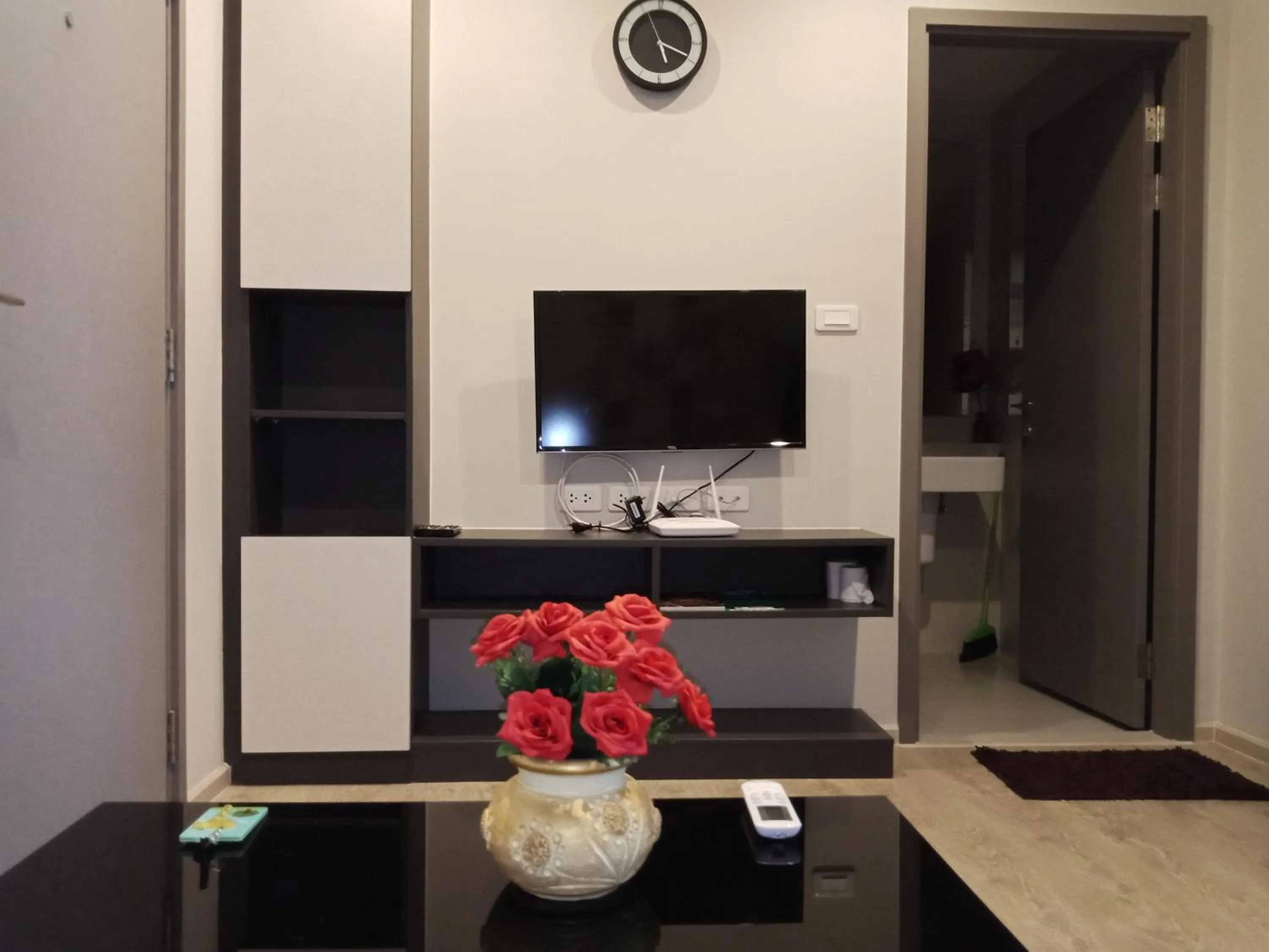 Living room in LLX Apartments at The Base condo