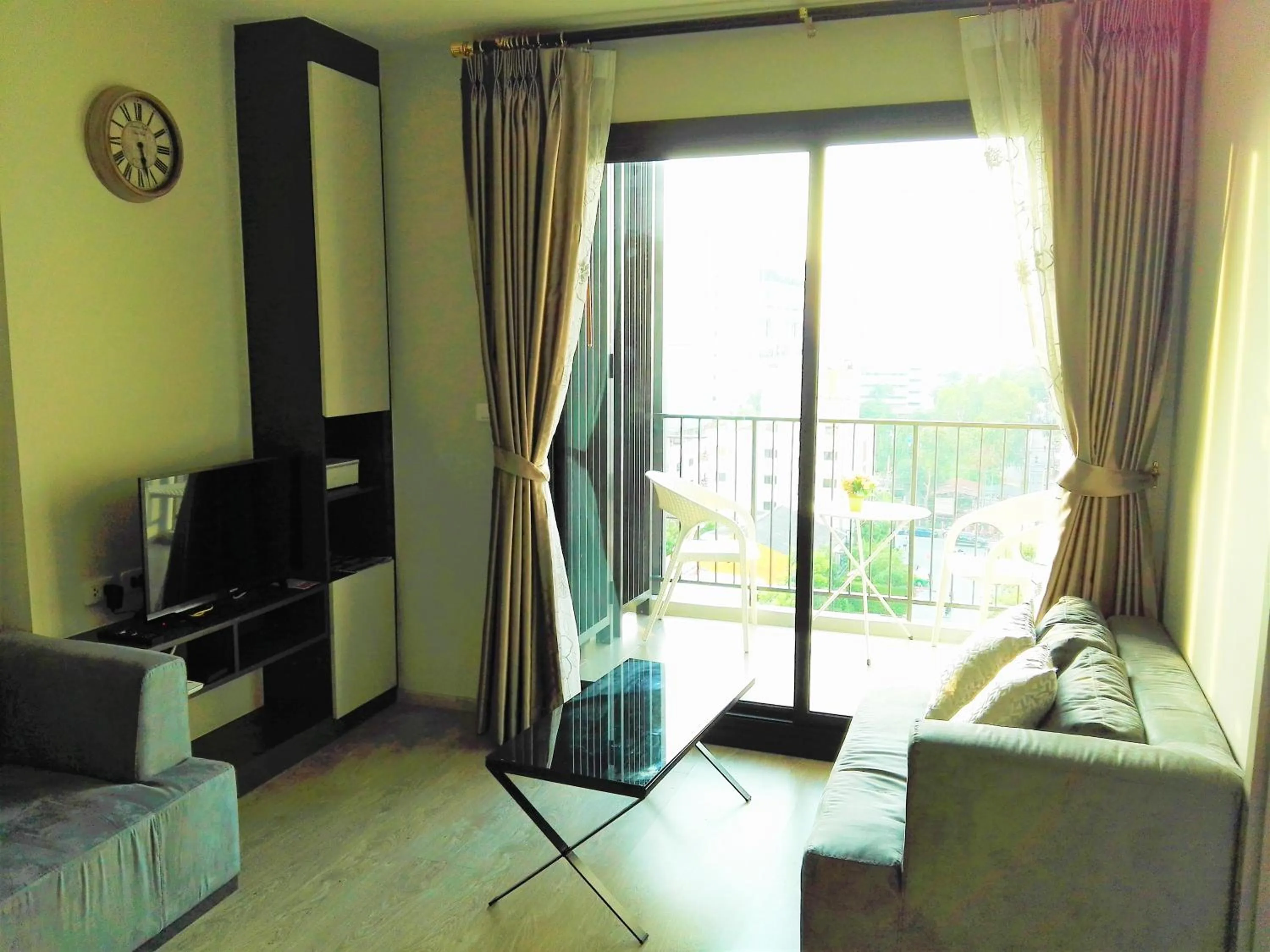 Living room in LLX Apartments at The Base condo