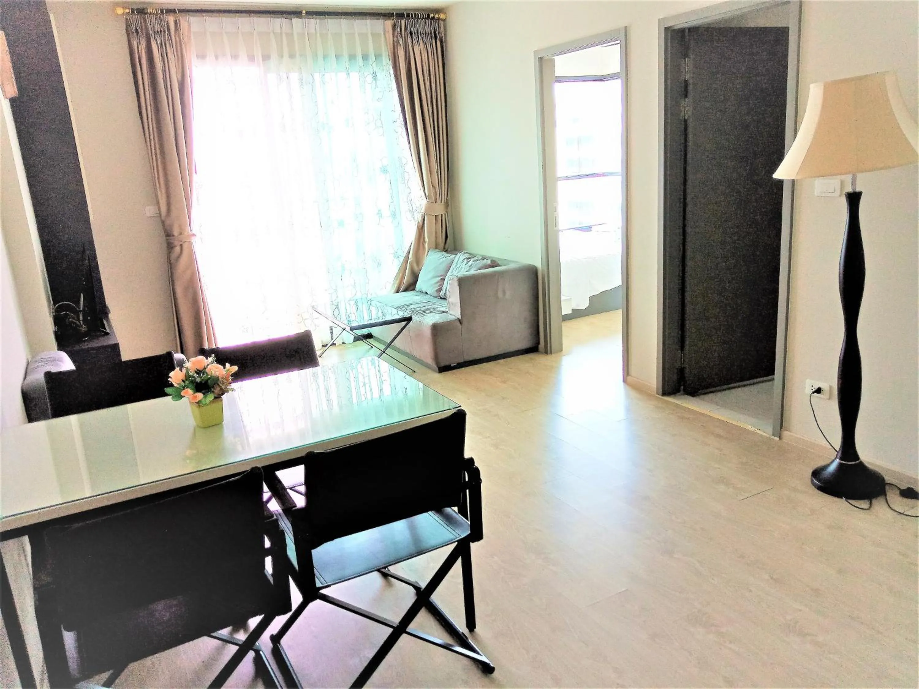 Living room in LLX Apartments at The Base condo