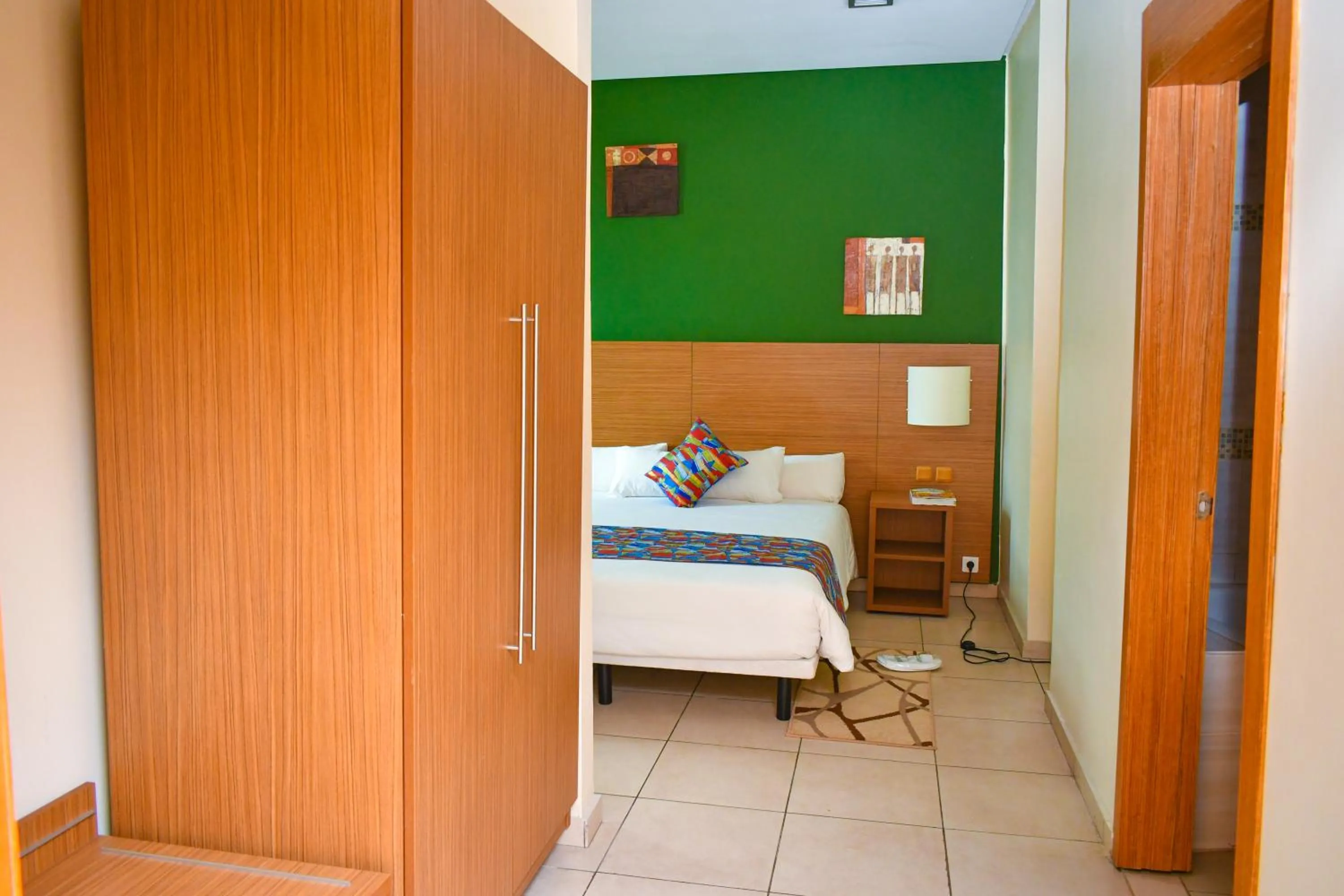 Bed in Palm Club Hotel