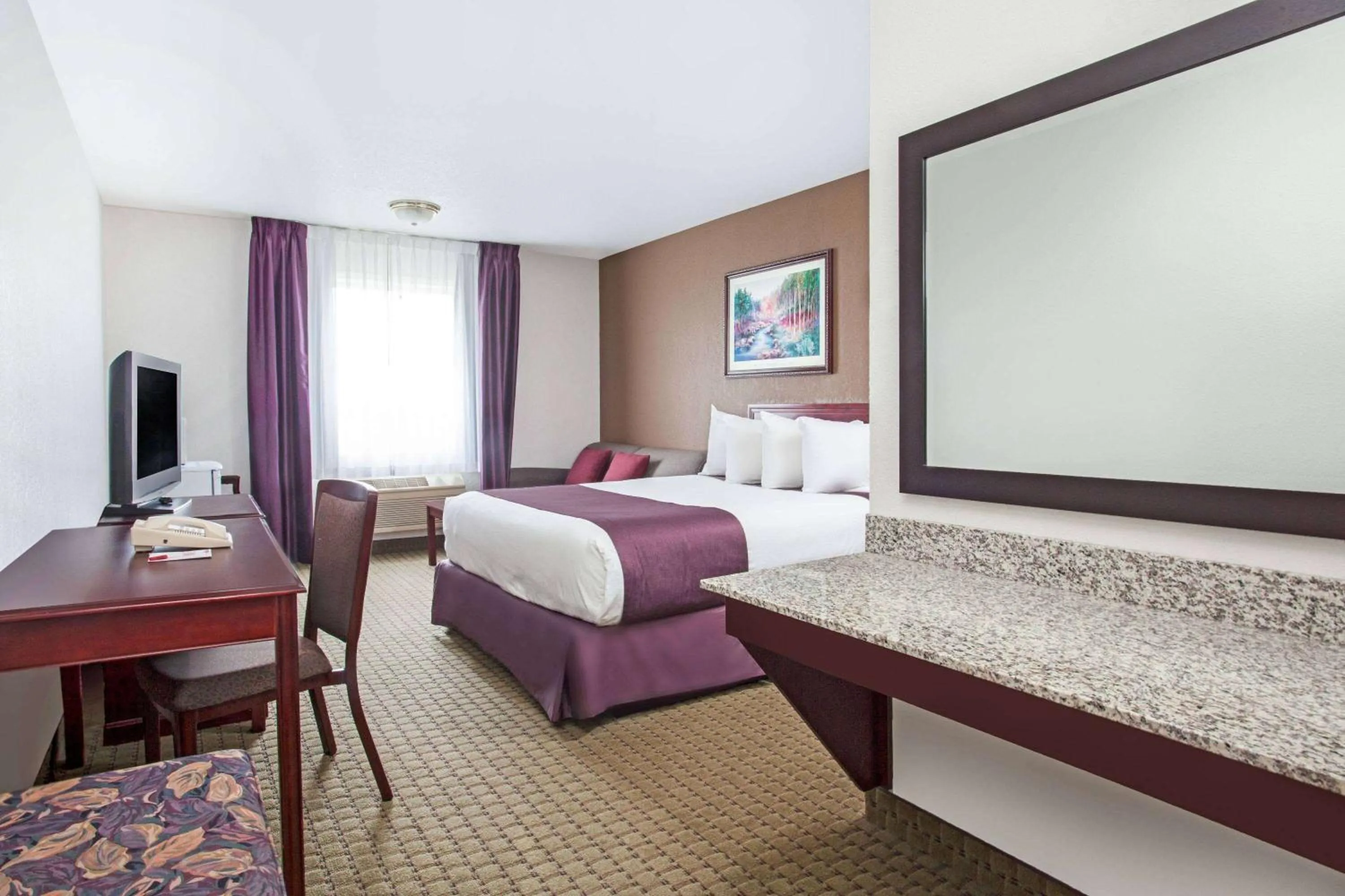 Bed in Ramada by Wyndham Red Deer Hotel & Suites