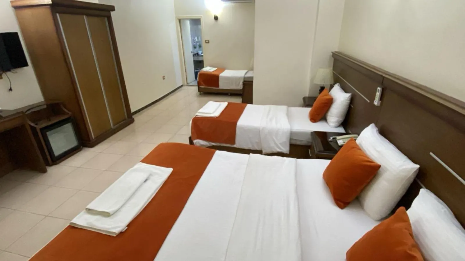 Communal lounge/ TV room, Bed in Sunset Hotel