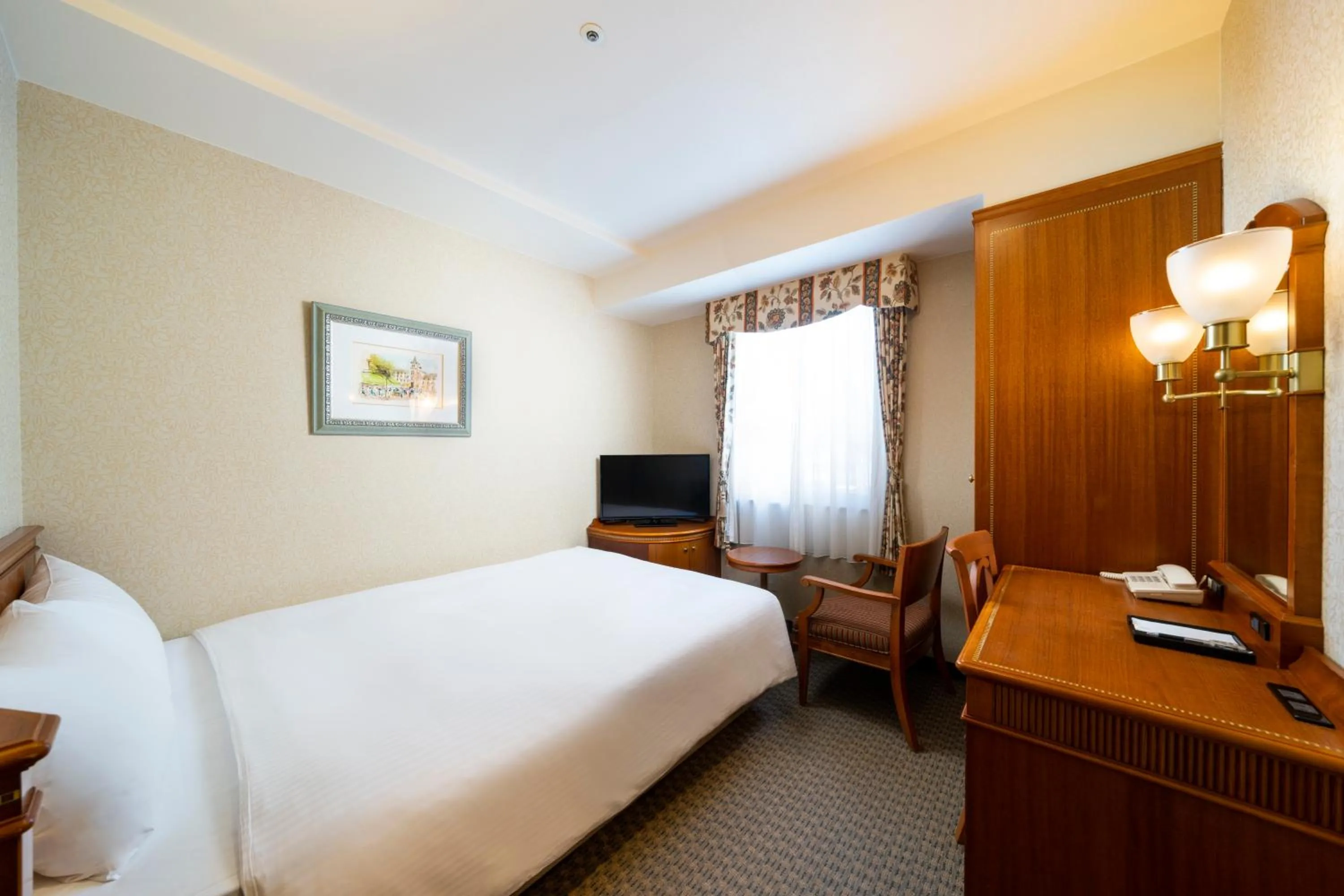 Bed in KOKO HOTEL Nagoya Sakae