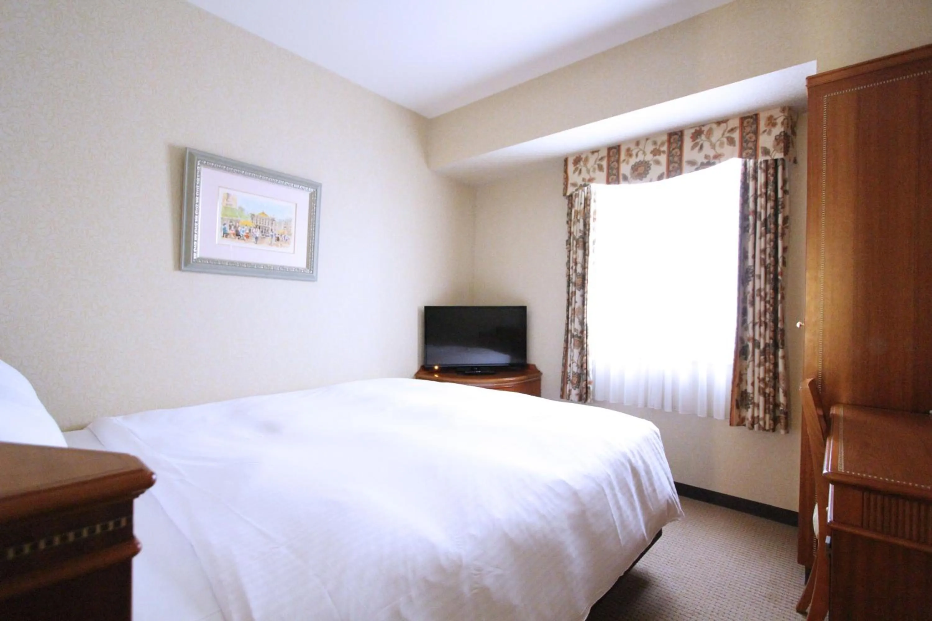 Bed in KOKO HOTEL Nagoya Sakae