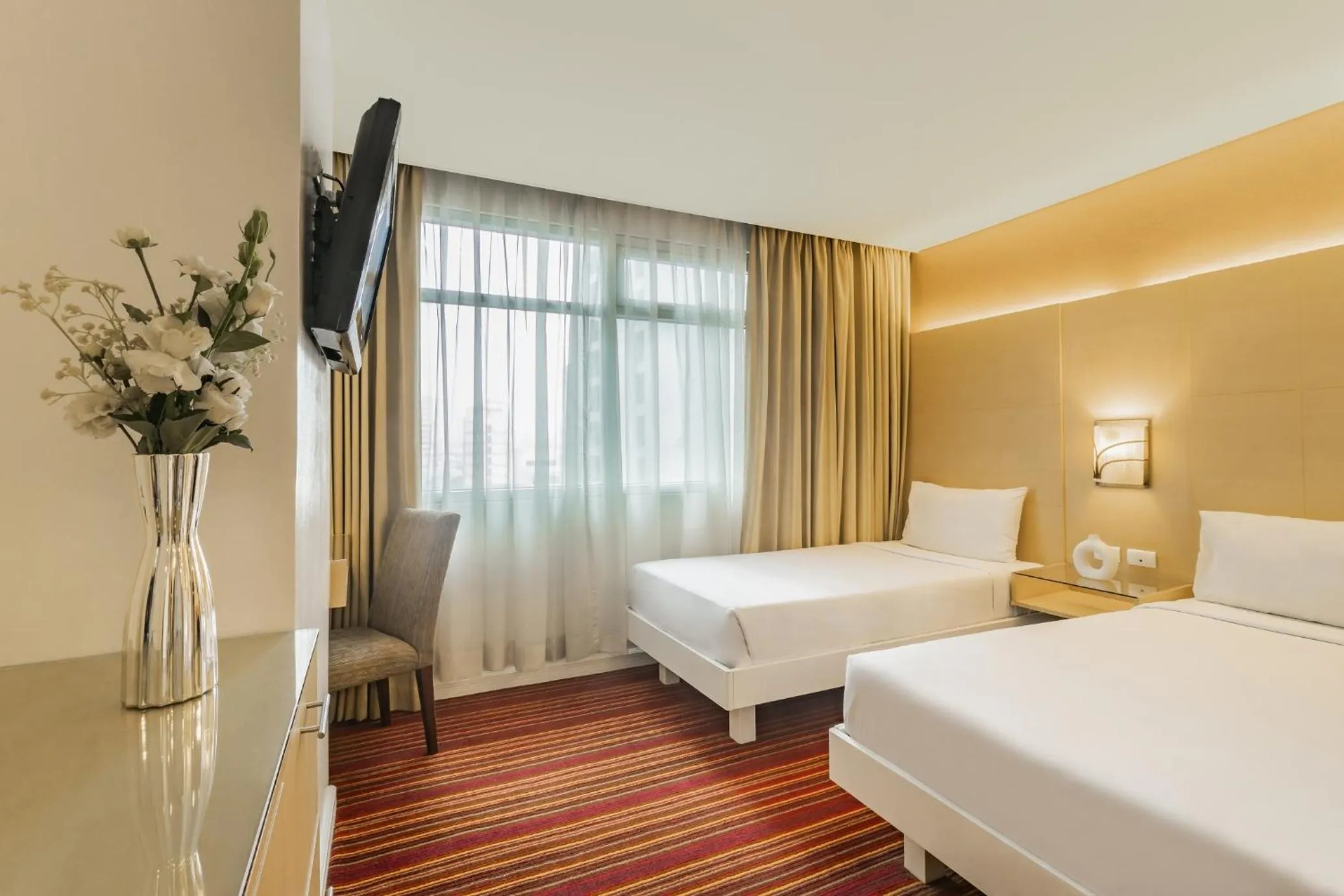 Bed in St Giles Hotel Makati