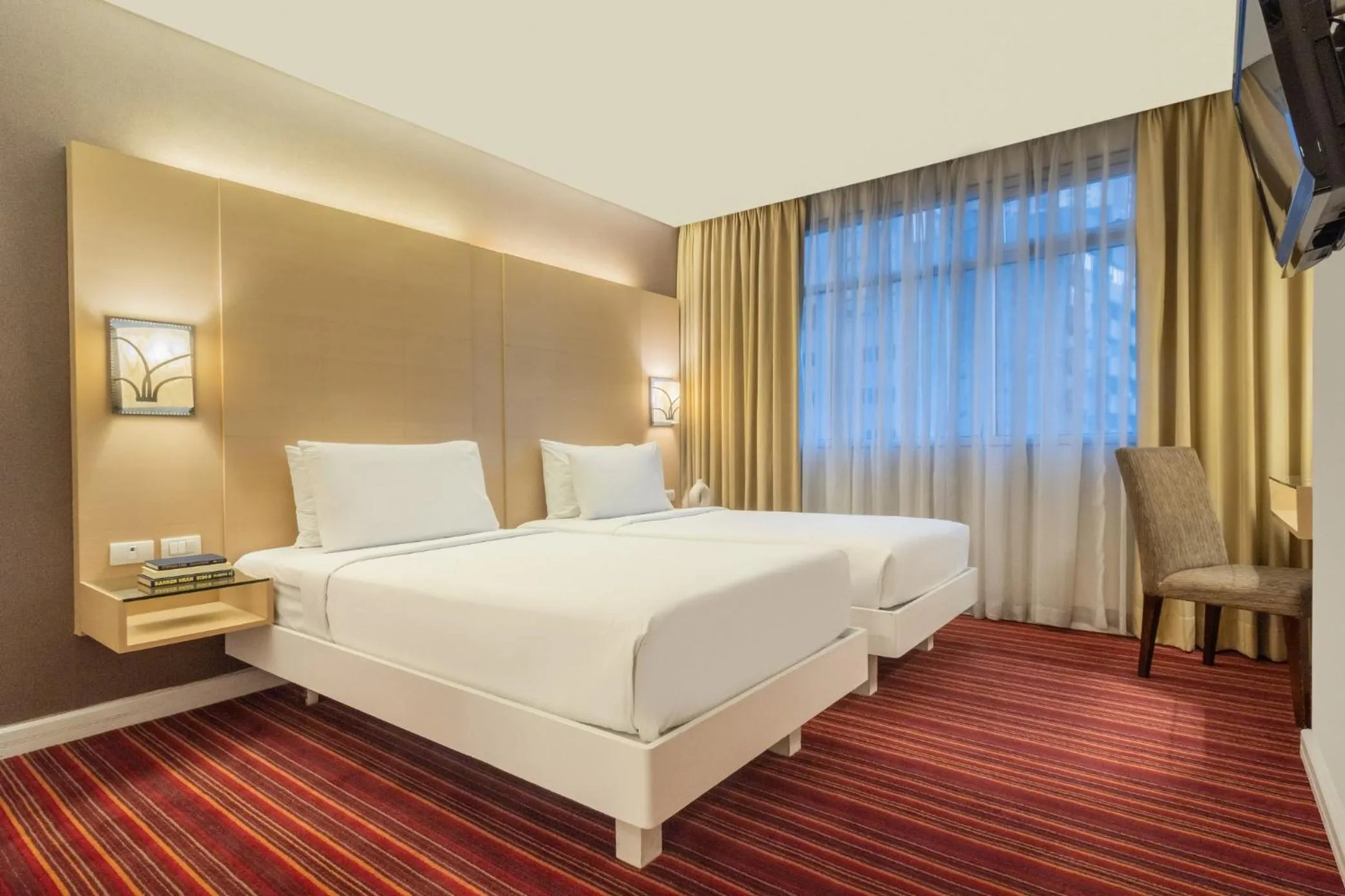 Bed in St Giles Hotel Makati