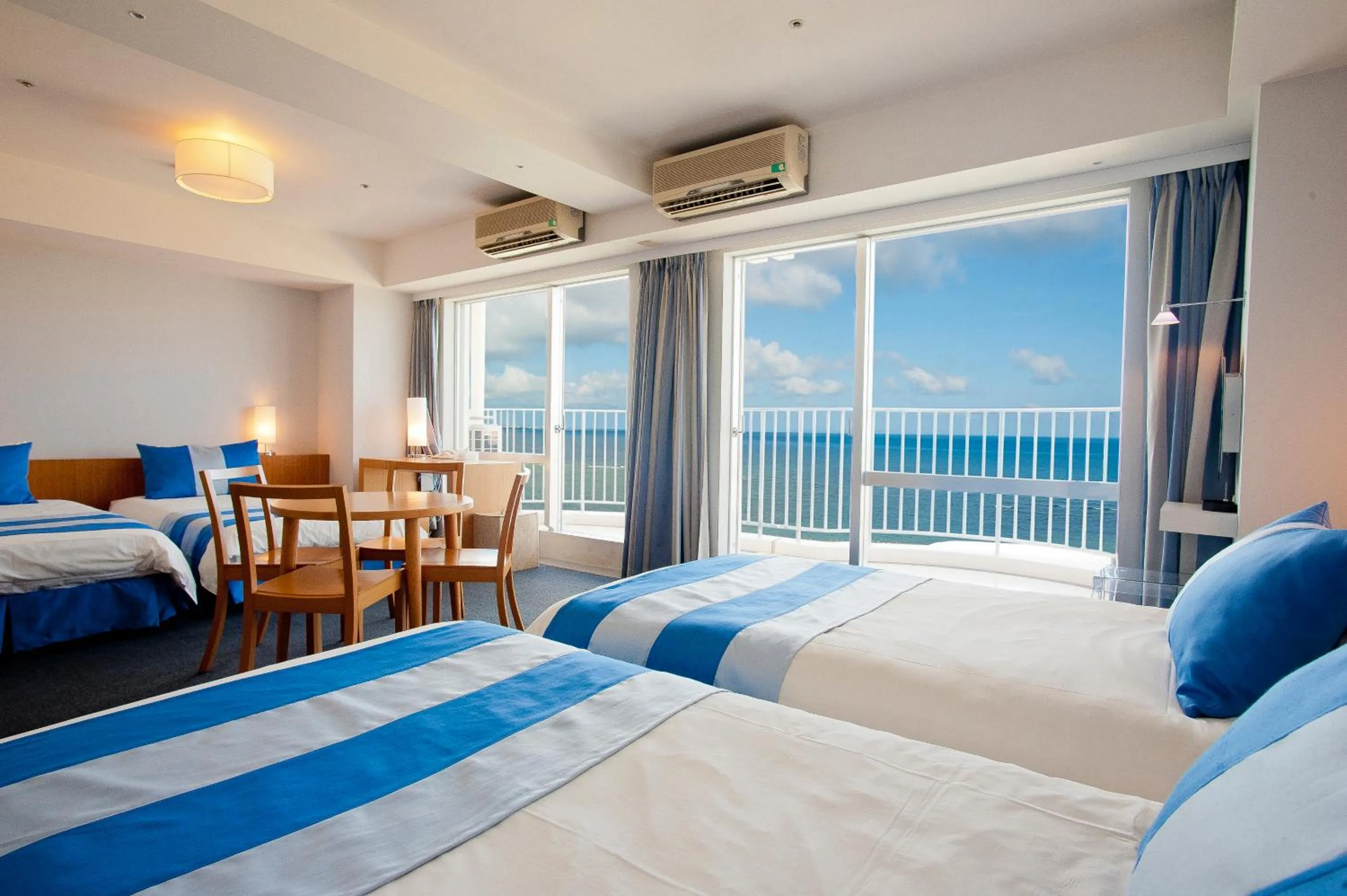 Photo of the whole room, Bed in The Beach Tower Okinawa