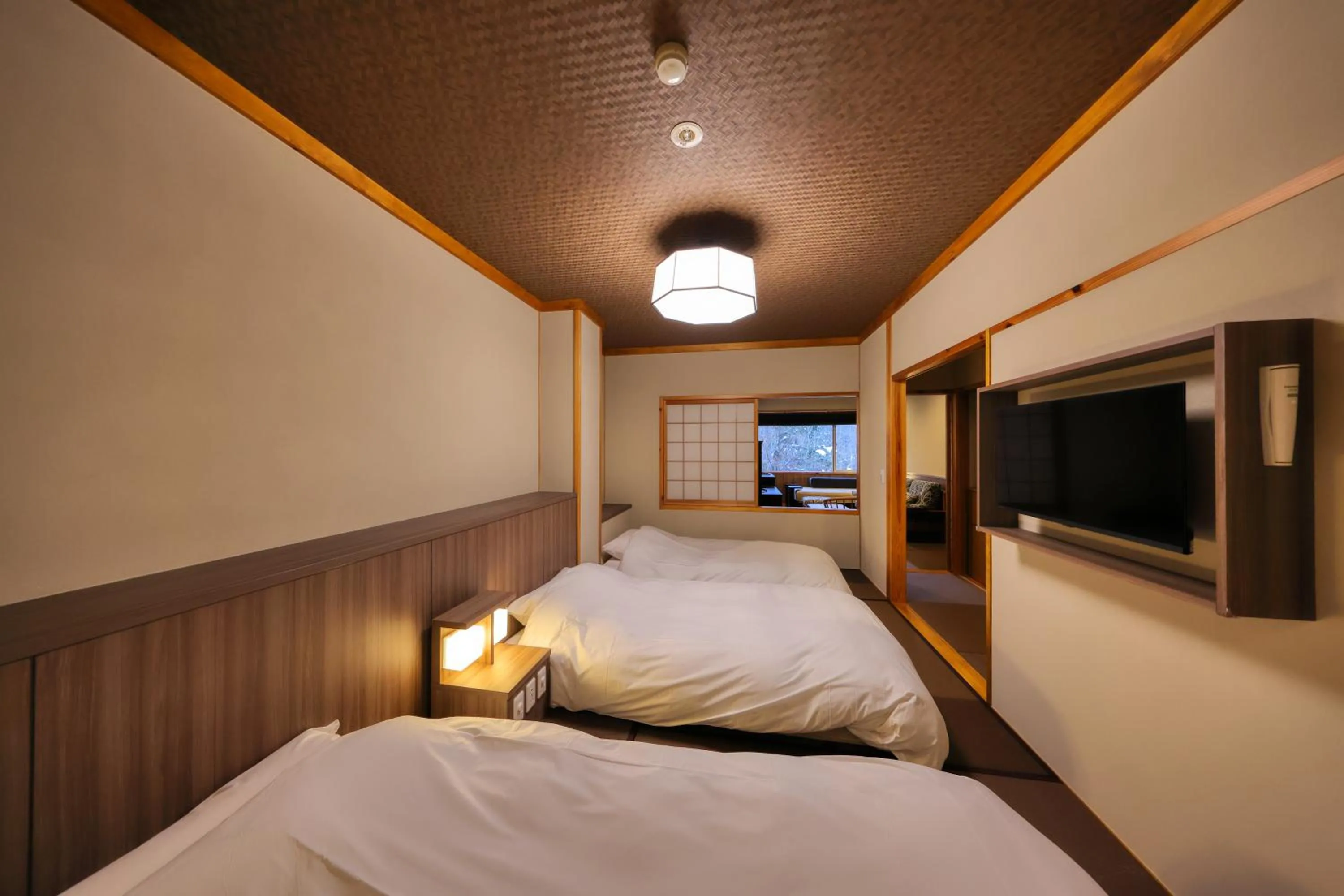 Bed in Miyama Ouan Kyoritsu Resort