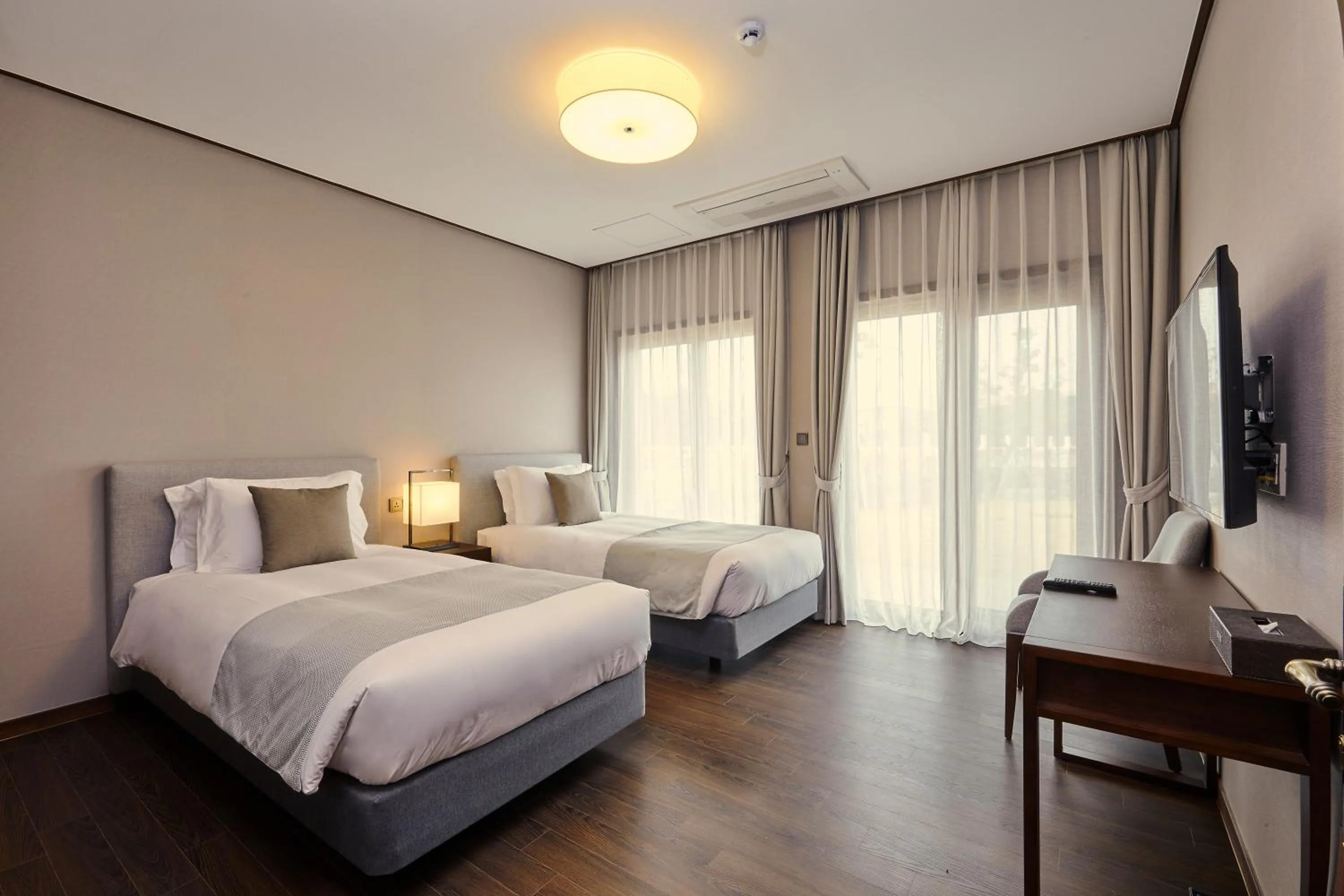 Bed in Camphortree Hotel and Resort