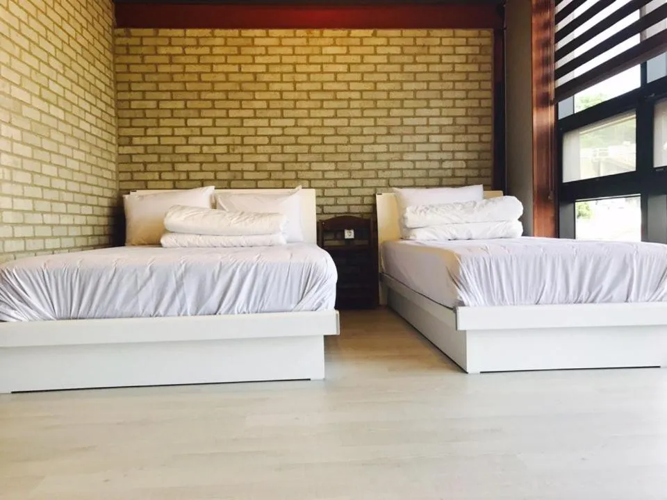 Bed in White Windmill Guesthouse