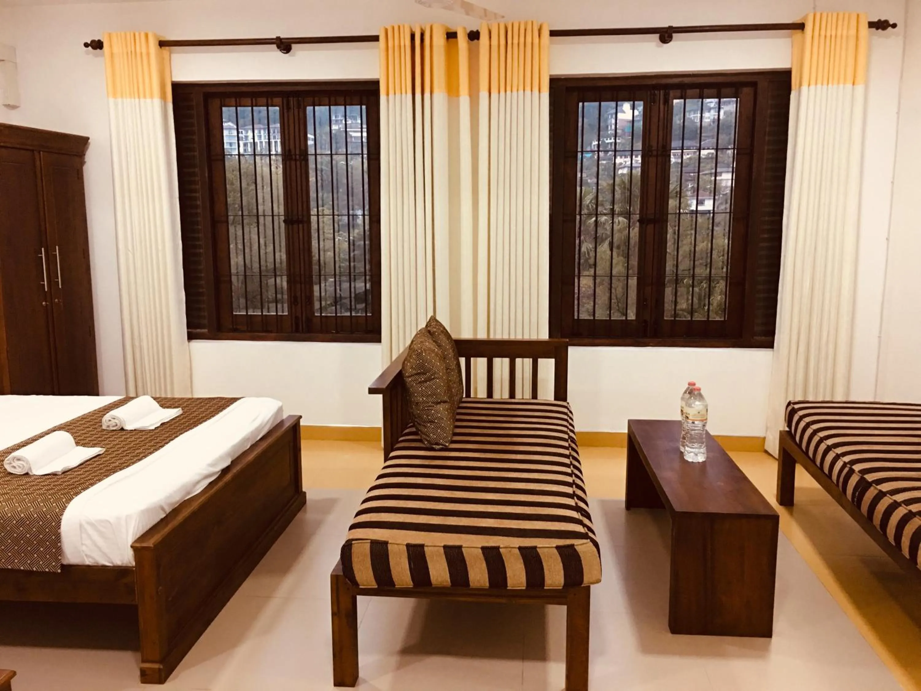 Living room, Bed in Sarvodaya Samma Vaasa Residence