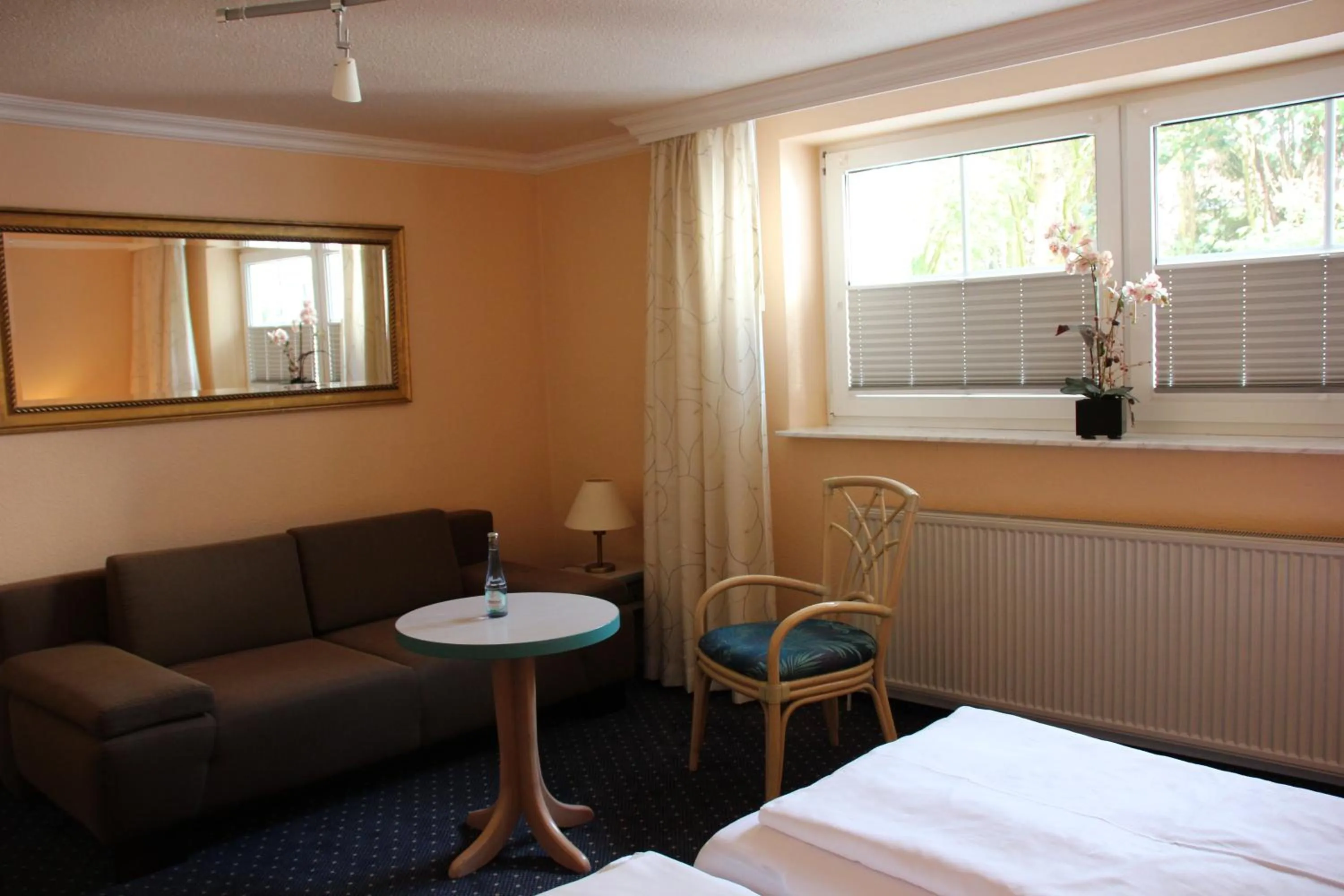 Seating area, Bed in Hotel Nordic