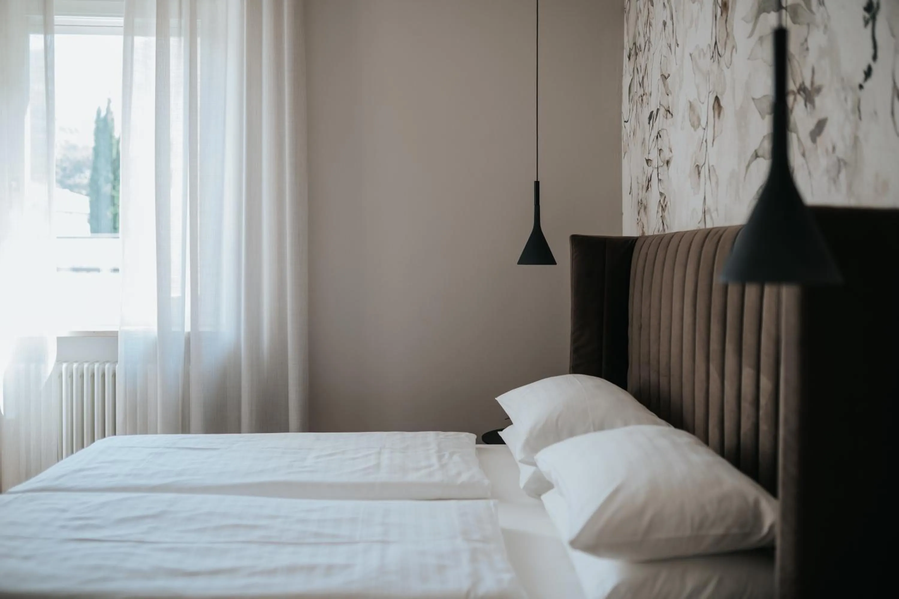 Bed in Windsor Merano Hotel & Suites