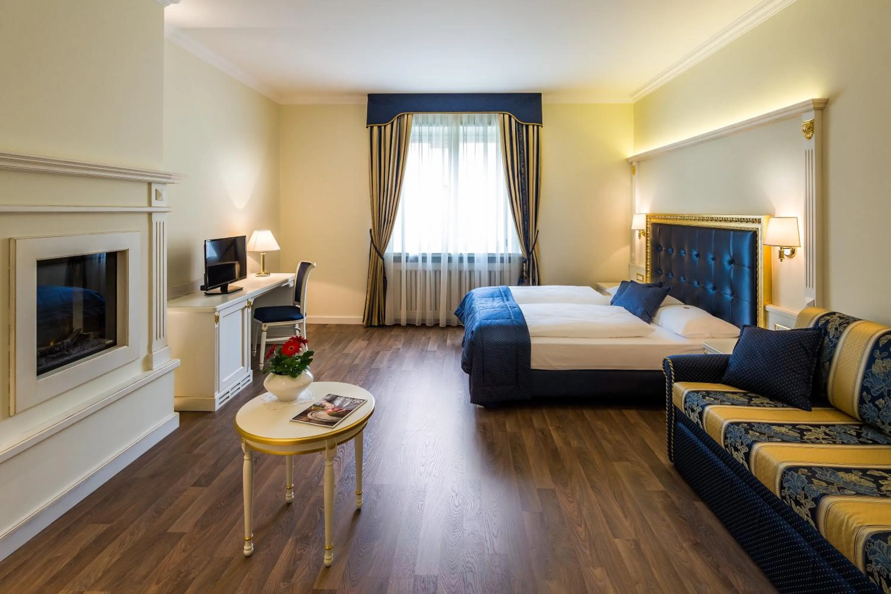 Photo of the whole room, Bed in Windsor Merano Hotel & Suites