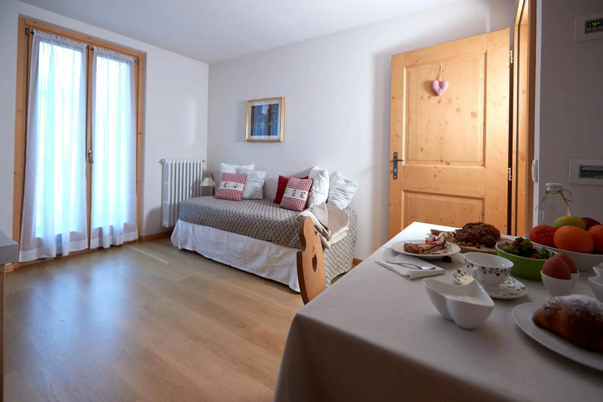 Seating area, Bed in Meublè Cima Bianca Garni