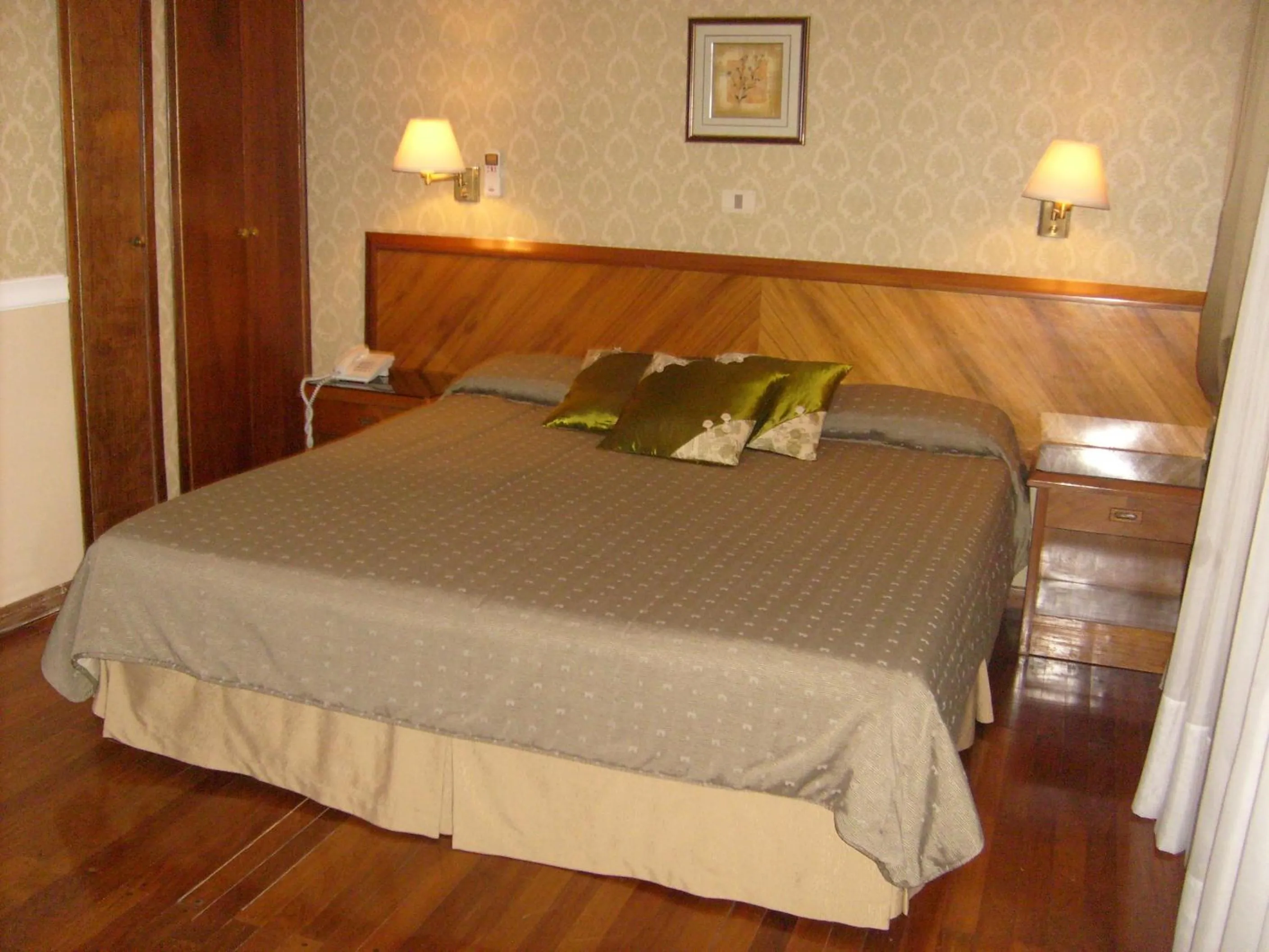 Bed in Premier Hill Suites Hotel