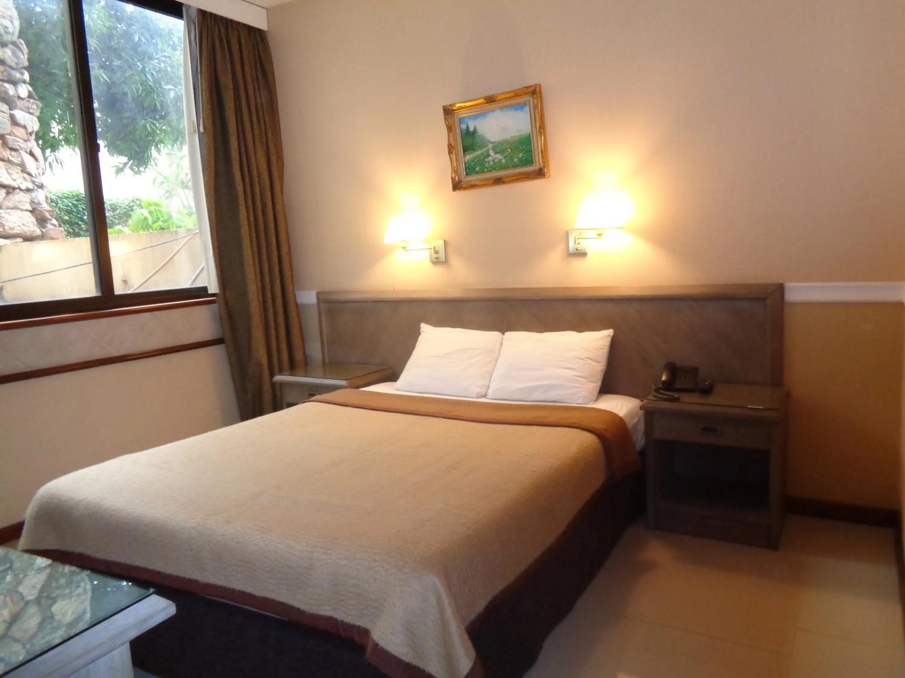 Bed in Premier Hill Suites Hotel