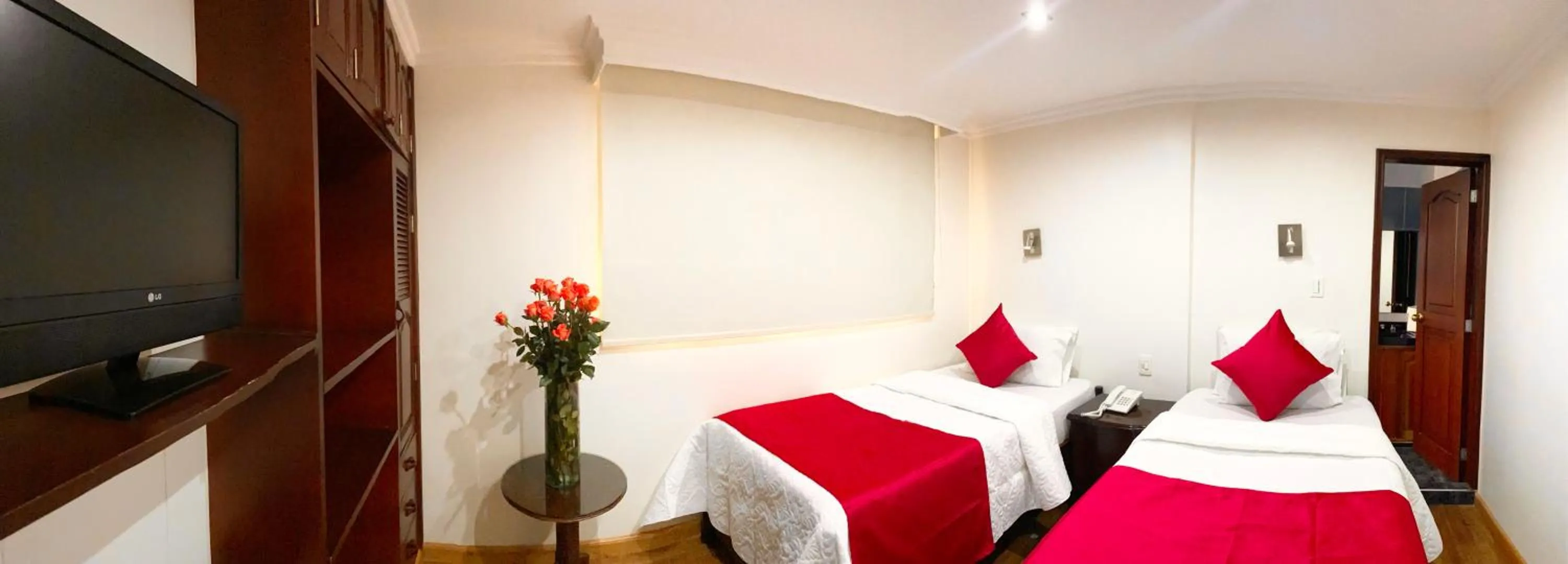 Communal lounge/ TV room, Bed in Hotel Fontibon