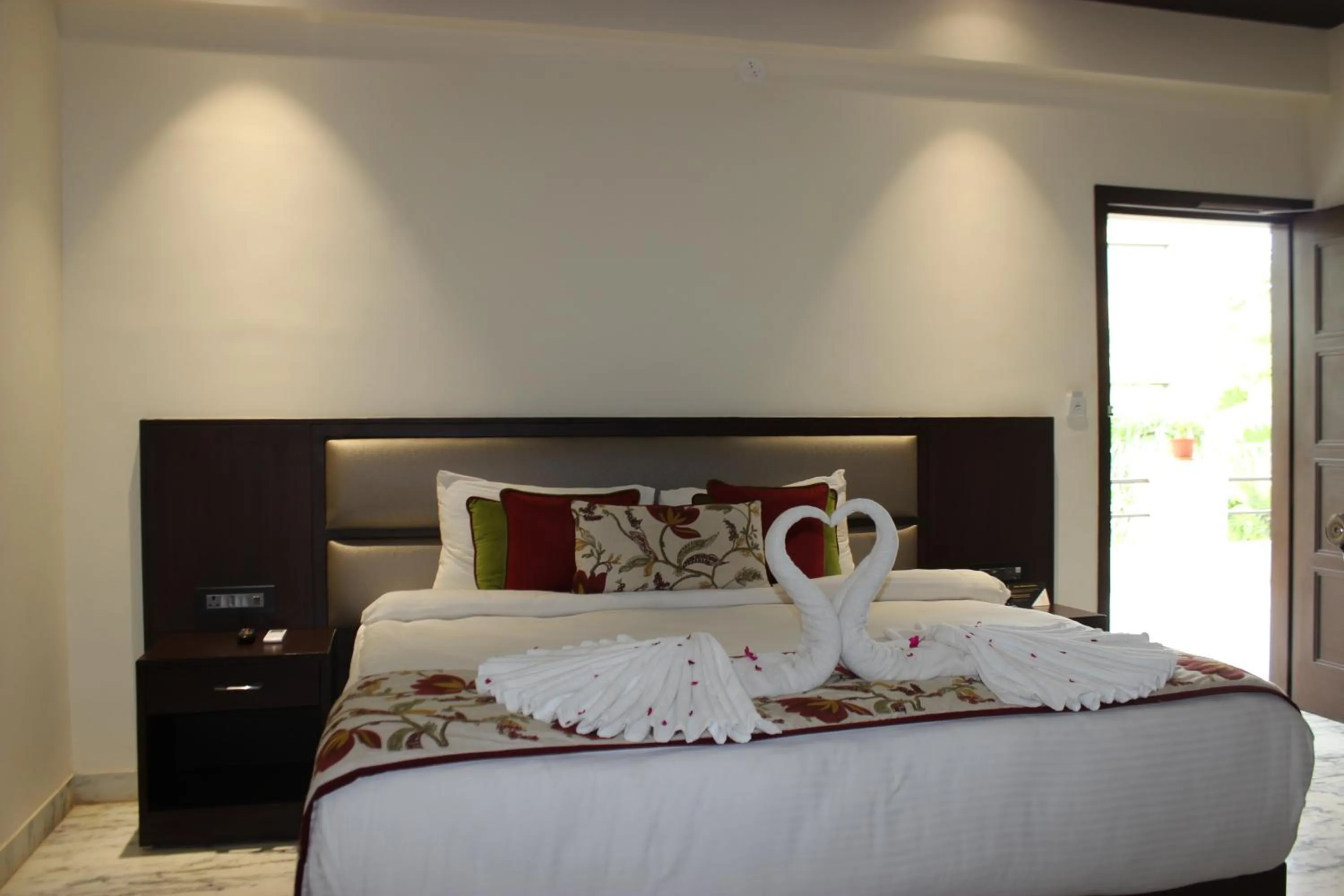 Bed in Ramya Resort & Spa