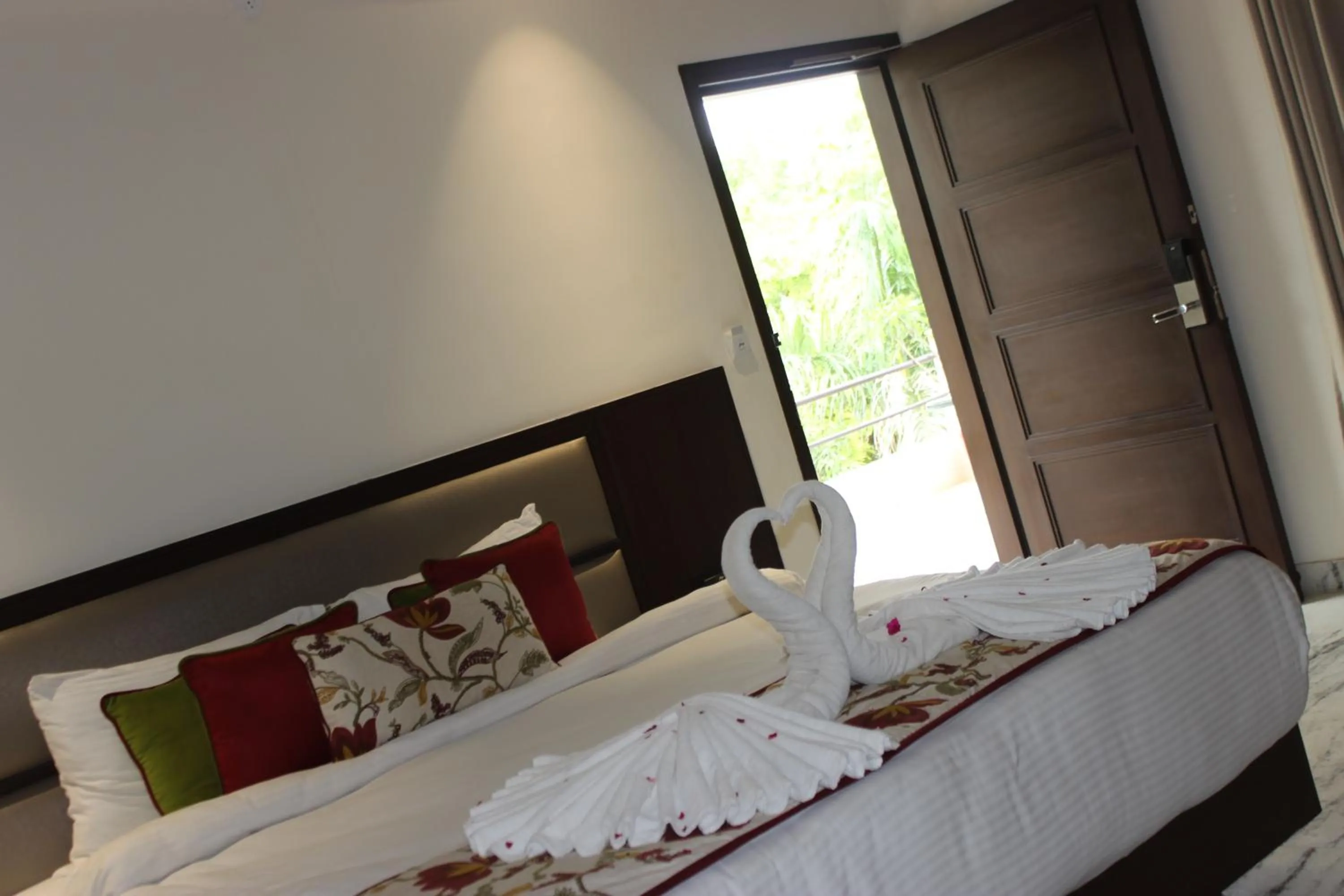 Bed in Ramya Resort & Spa
